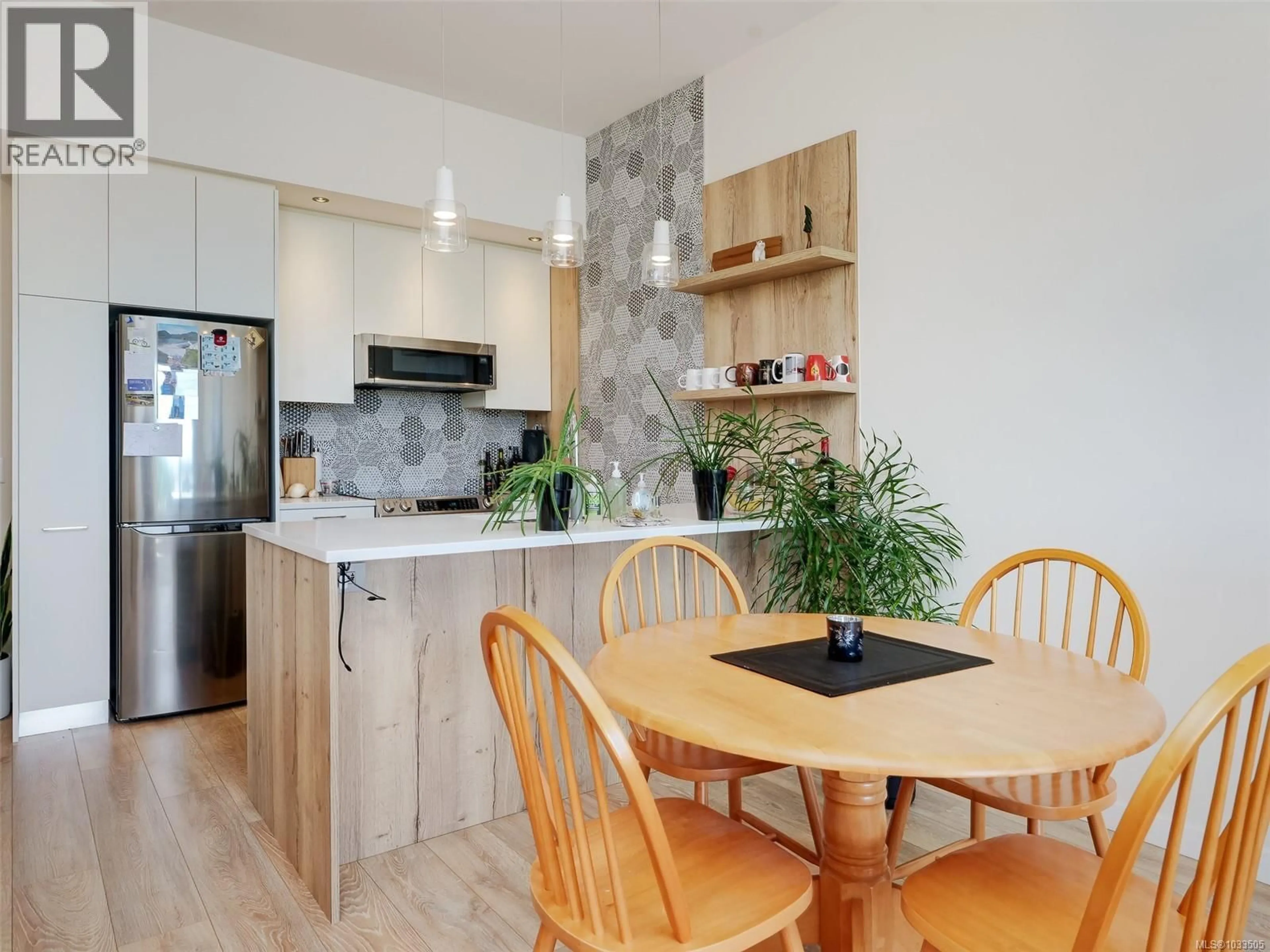 Open concept kitchen, wood/laminate floor for 404 - 1588 NORTH DAIRY ROAD, Saanich British Columbia V8T3V4