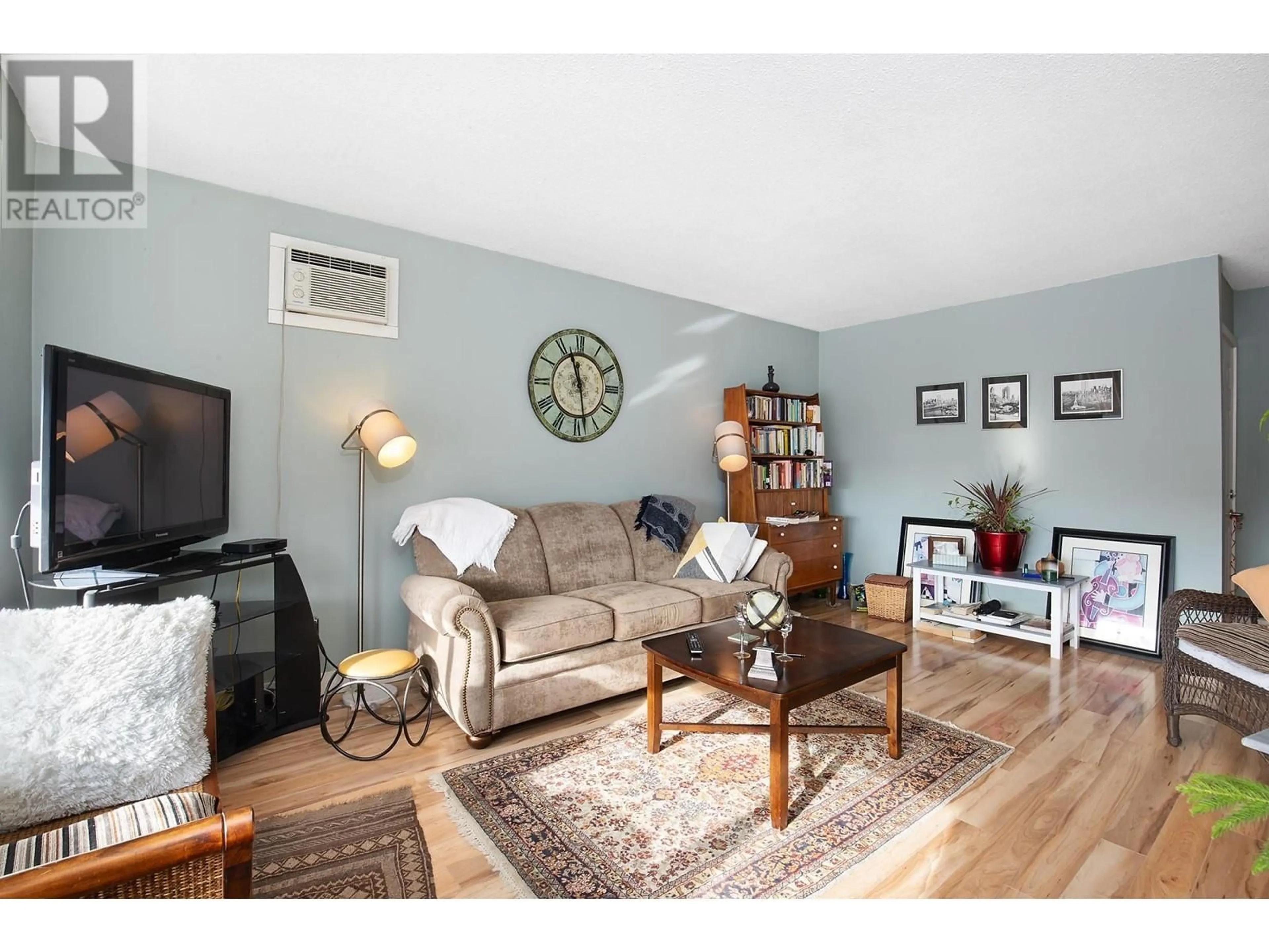 Living room with furniture, wood/laminate floor for 824 Georgeann Road, Kamloops British Columbia V2B6H8