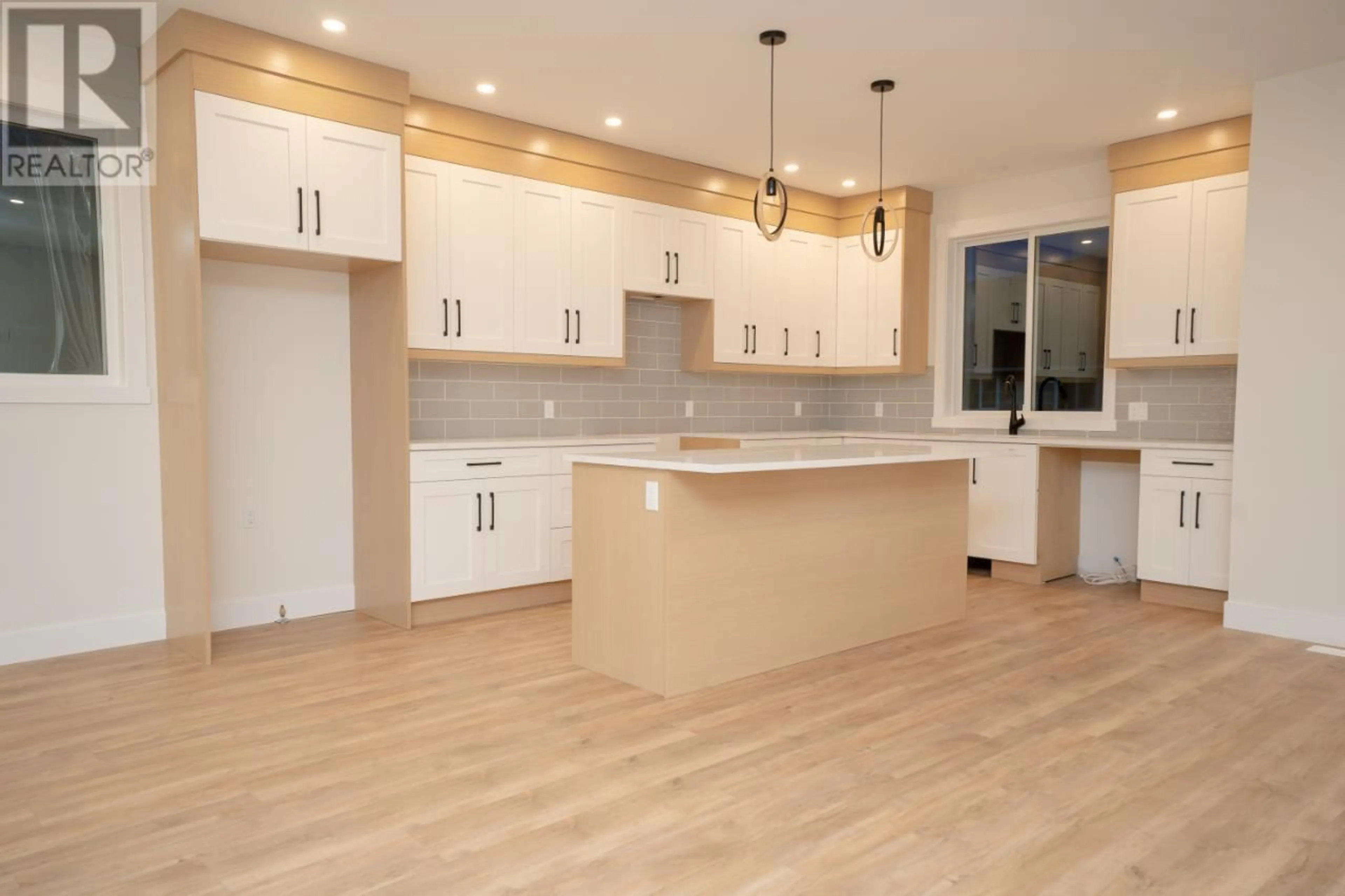 Open concept kitchen, wood/laminate floor for B 2969 GILBERT Road, Kamloops British Columbia V2B7A9