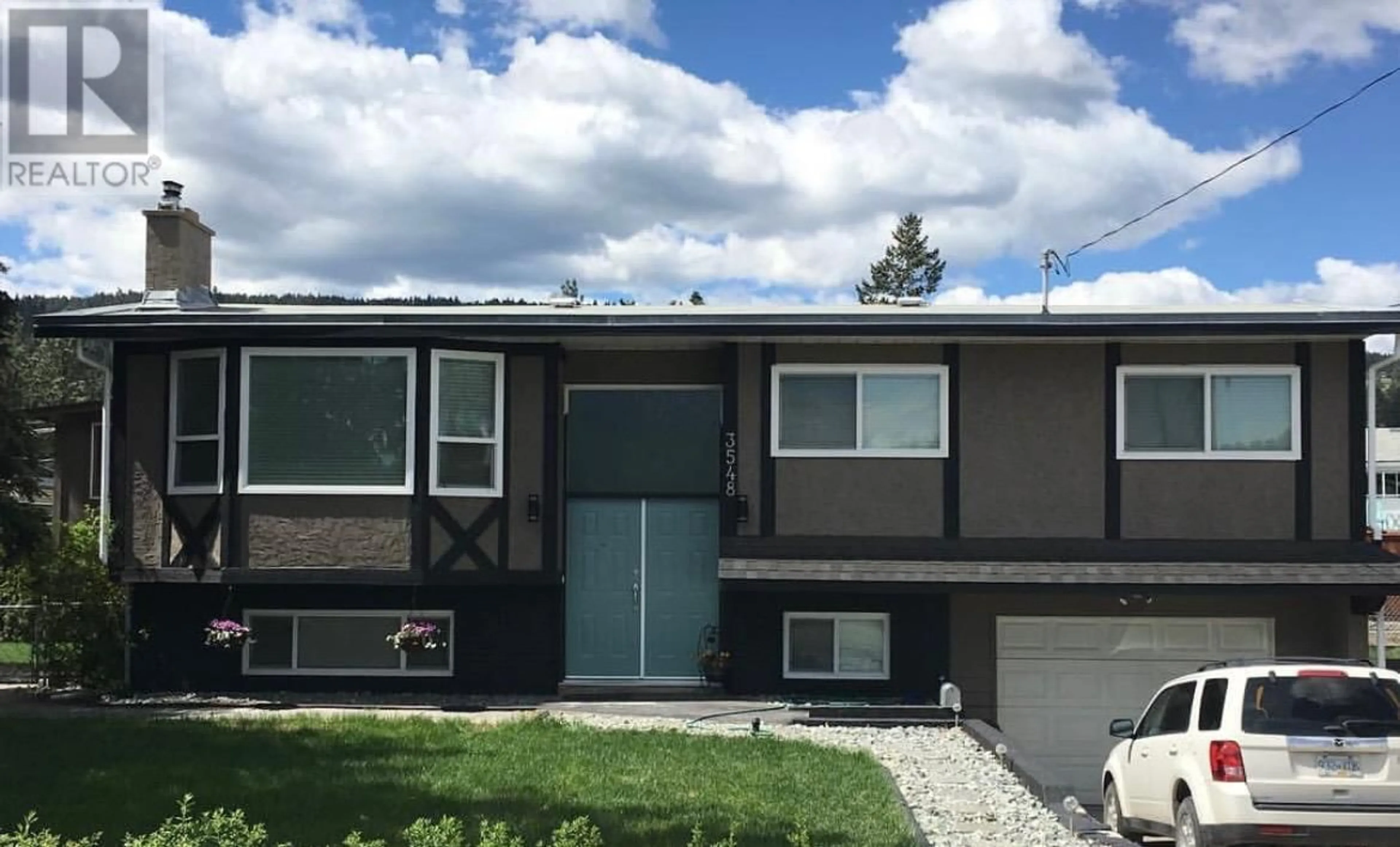 Home with vinyl exterior material, street for 3548 MacDonnel Road, West Kelowna British Columbia V4T1J1