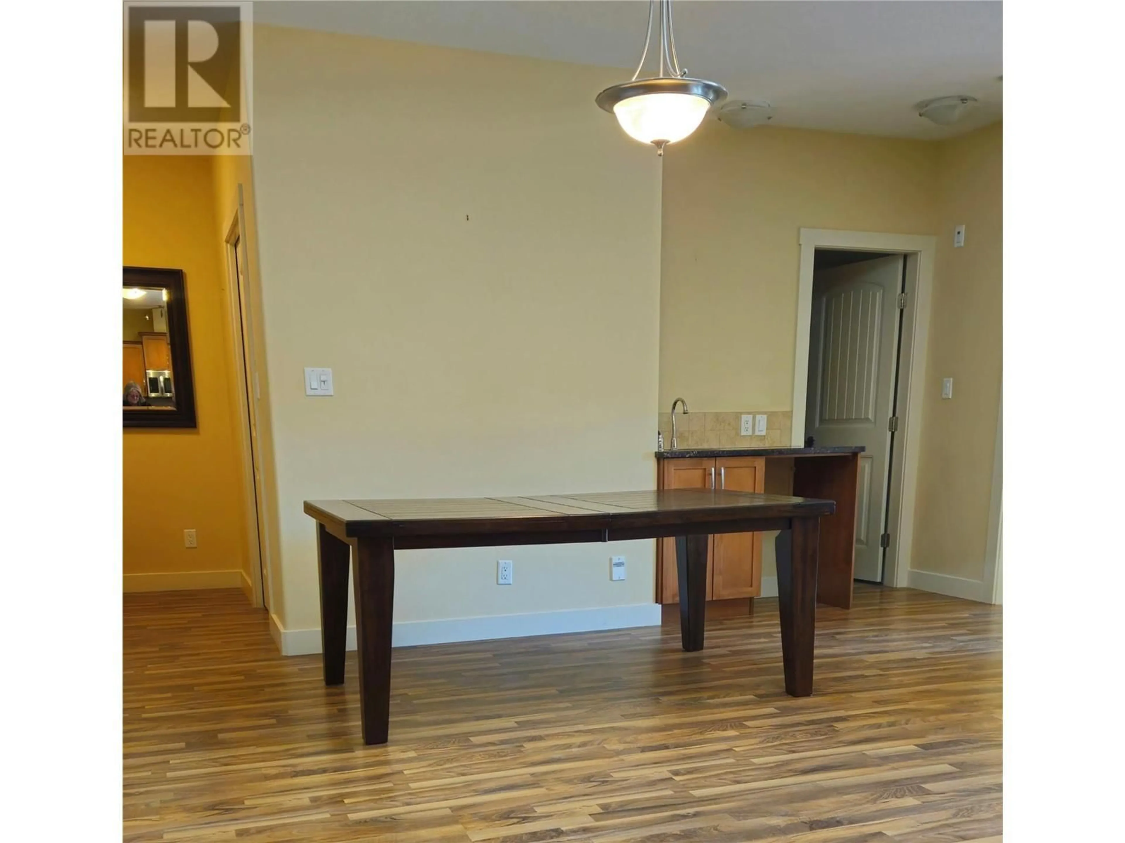 Dining room, wood/laminate floor for 13615 Victoria Road Unit# 204, Summerland British Columbia V0H1Z5