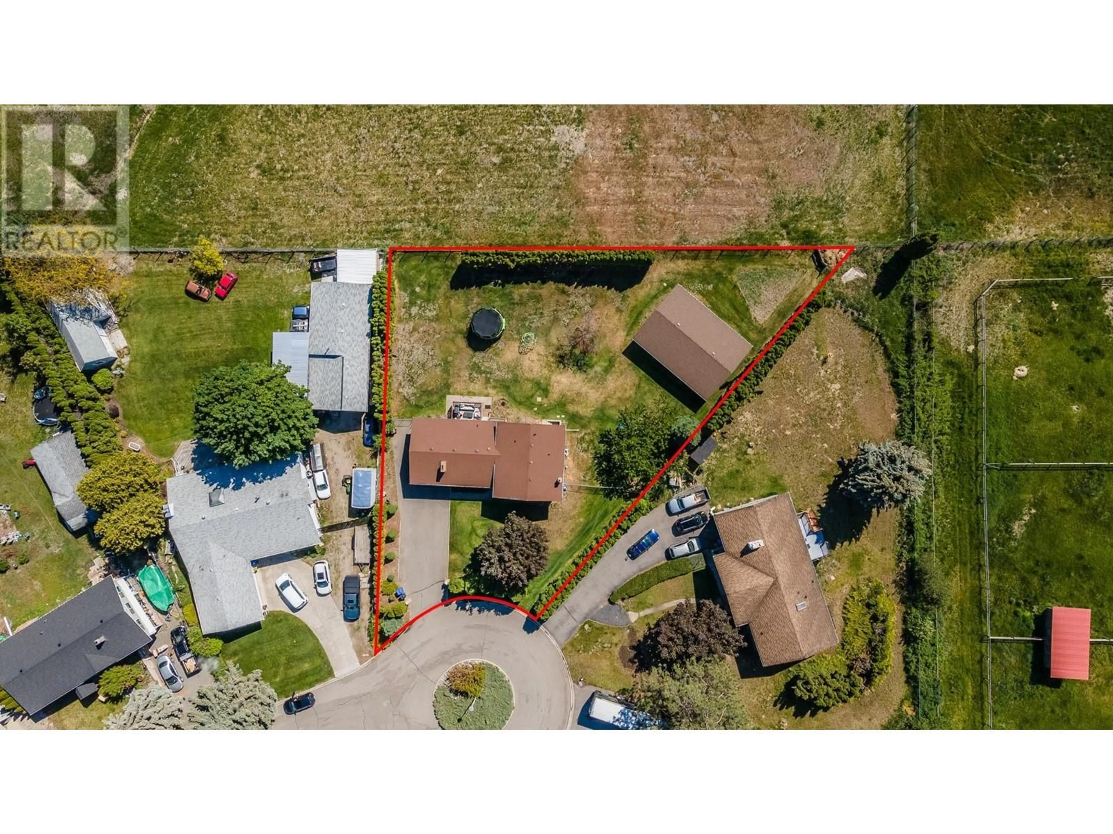 A pic from outside/outdoor area/front of a property/back of a property/a pic from drone, street for 2160 Diamond Road, Kelowna British Columbia V1W4B9