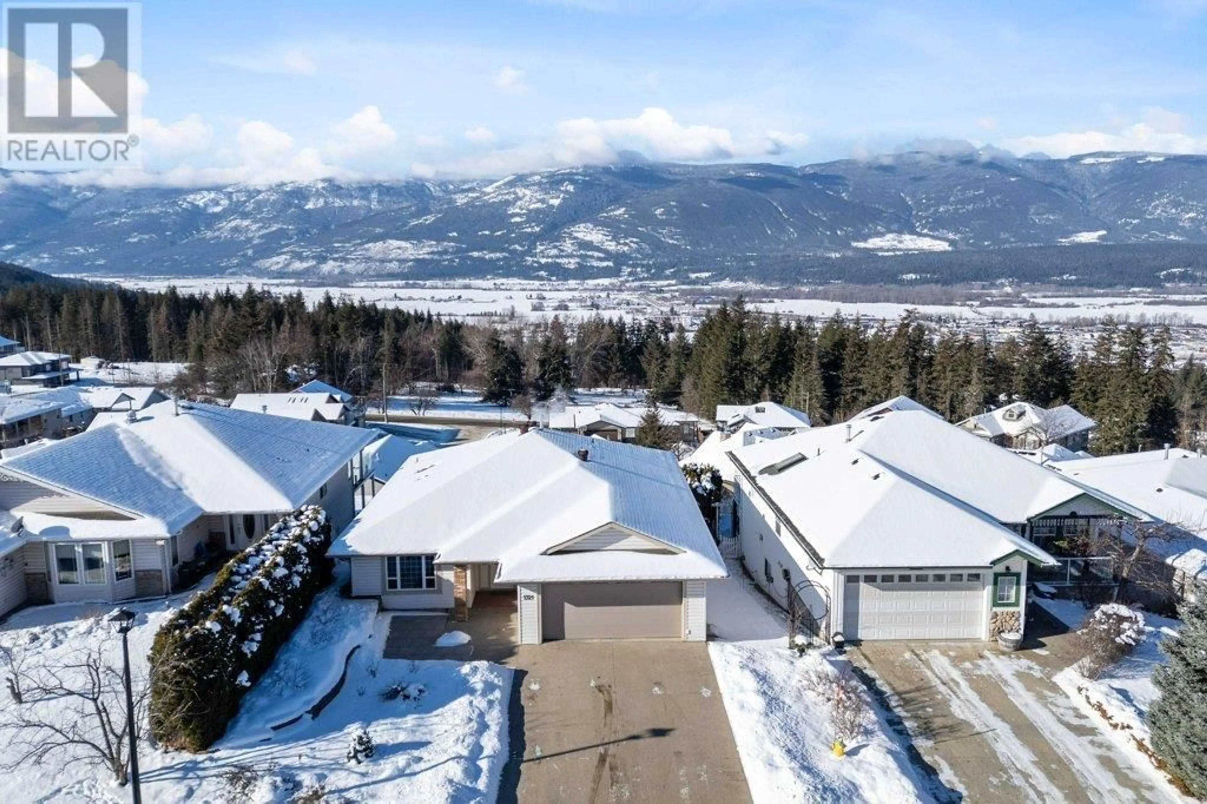 A pic from outside/outdoor area/front of a property/back of a property/a pic from drone, mountain view for 1321 12 Street SE, Salmon Arm British Columbia V1E2R6