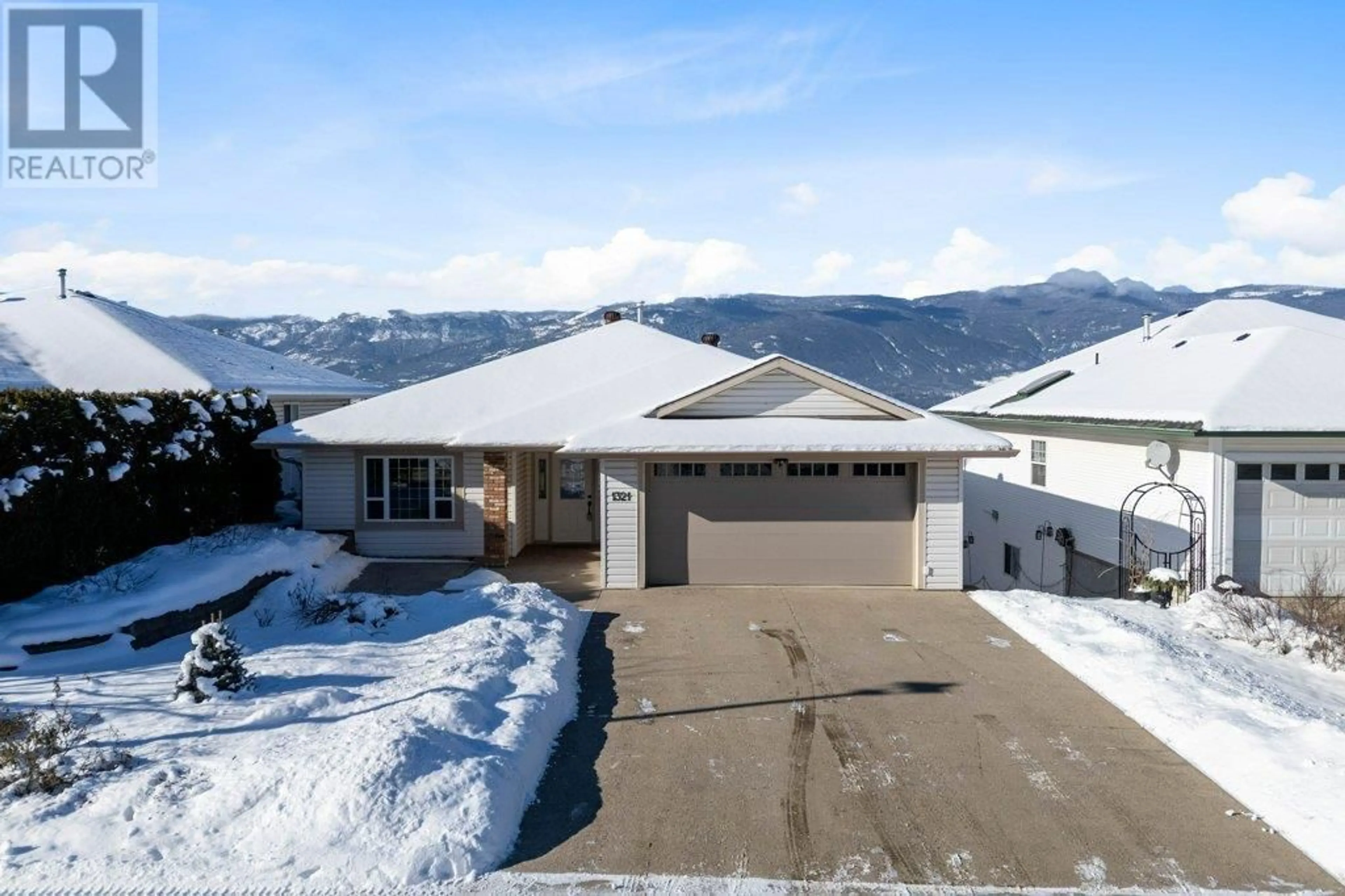 A pic from outside/outdoor area/front of a property/back of a property/a pic from drone, mountain view for 1321 12 Street SE, Salmon Arm British Columbia V1E2R6