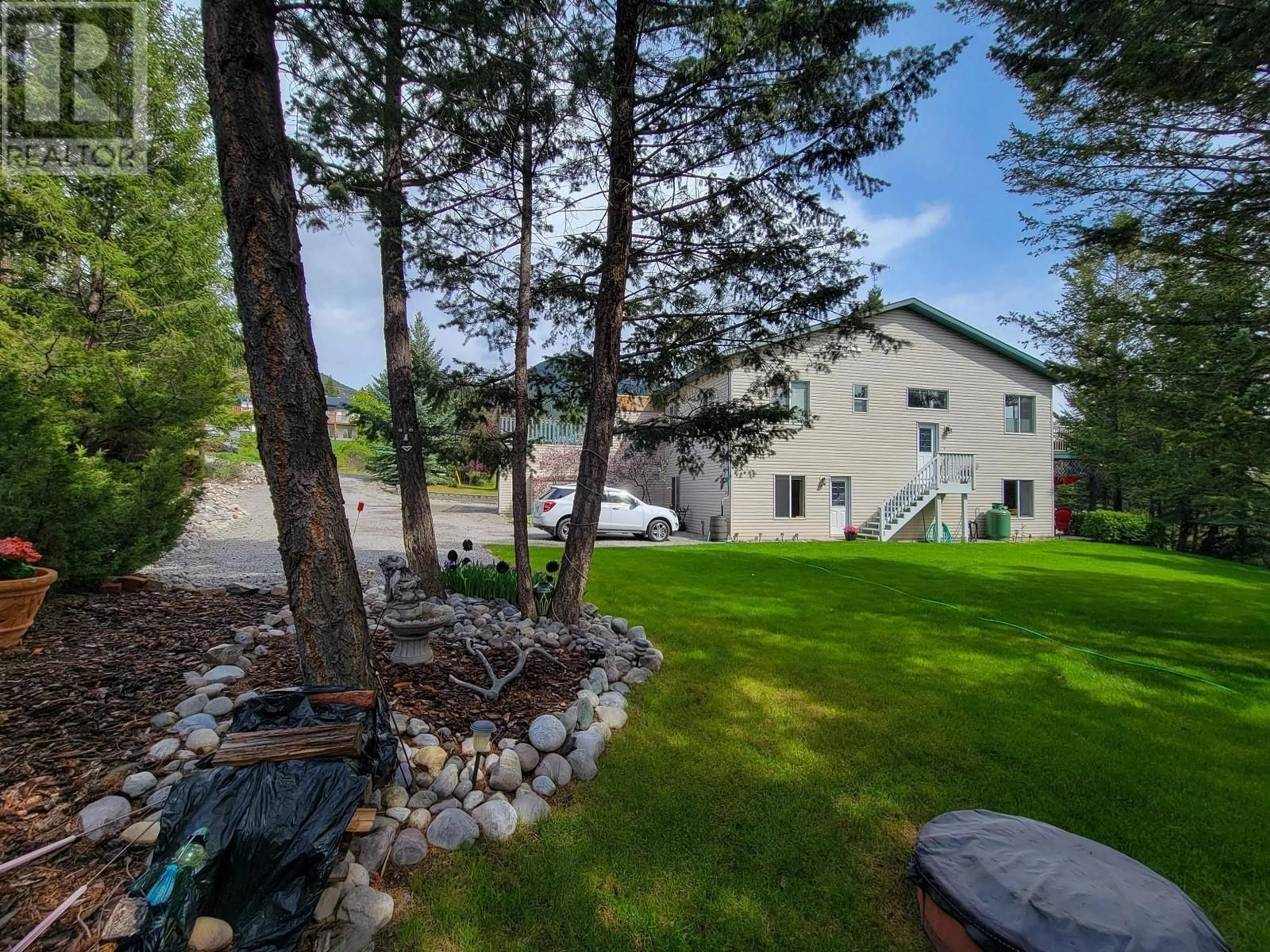 A pic from outside/outdoor area/front of a property/back of a property/a pic from drone, water/lake/river/ocean view for 31A WOLF CRESCENT, Invermere British Columbia V0A1K2