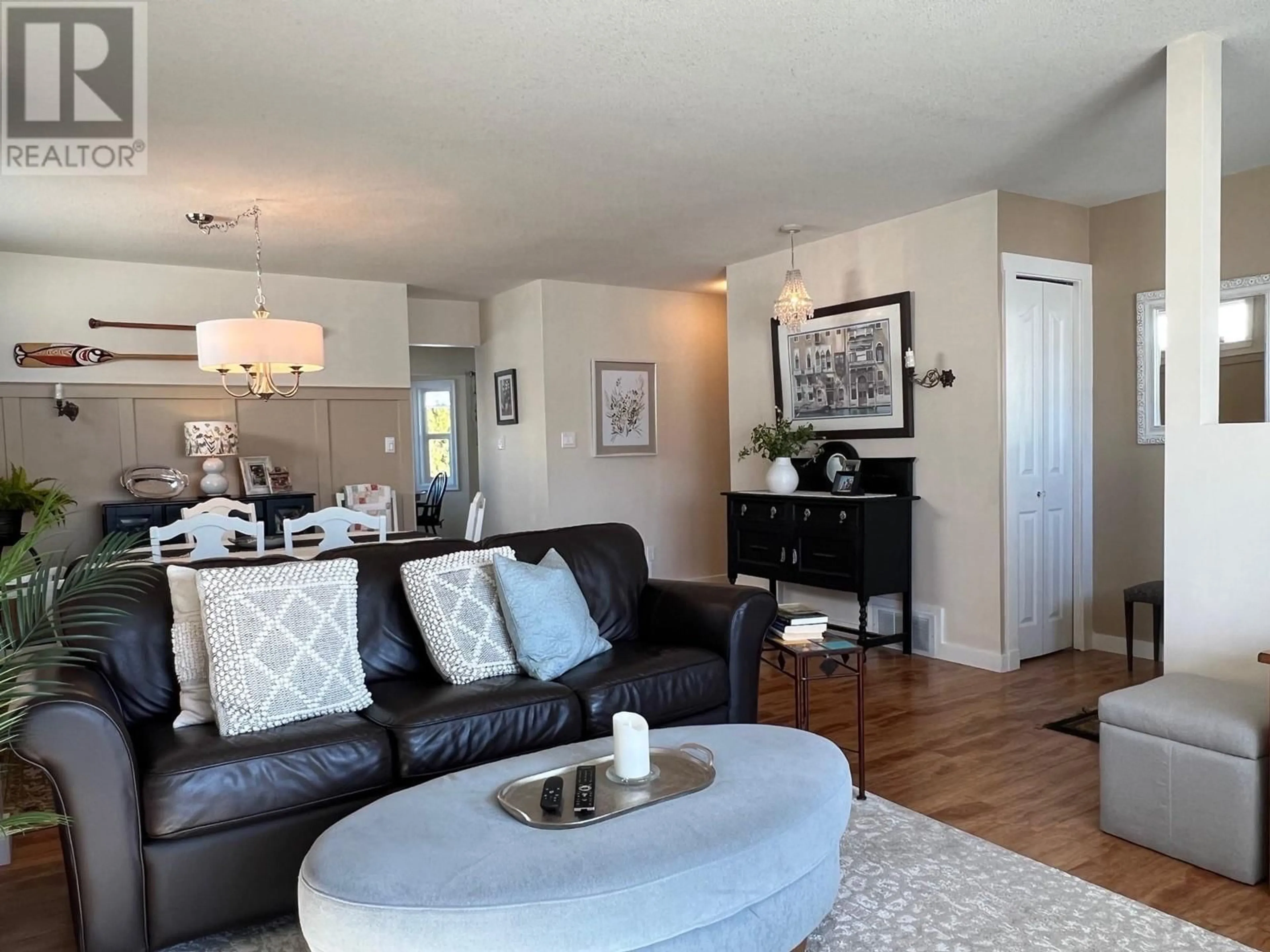 Living room with furniture, wood/laminate floor for 814 8 Avenue, Vernon British Columbia V1H1Z1