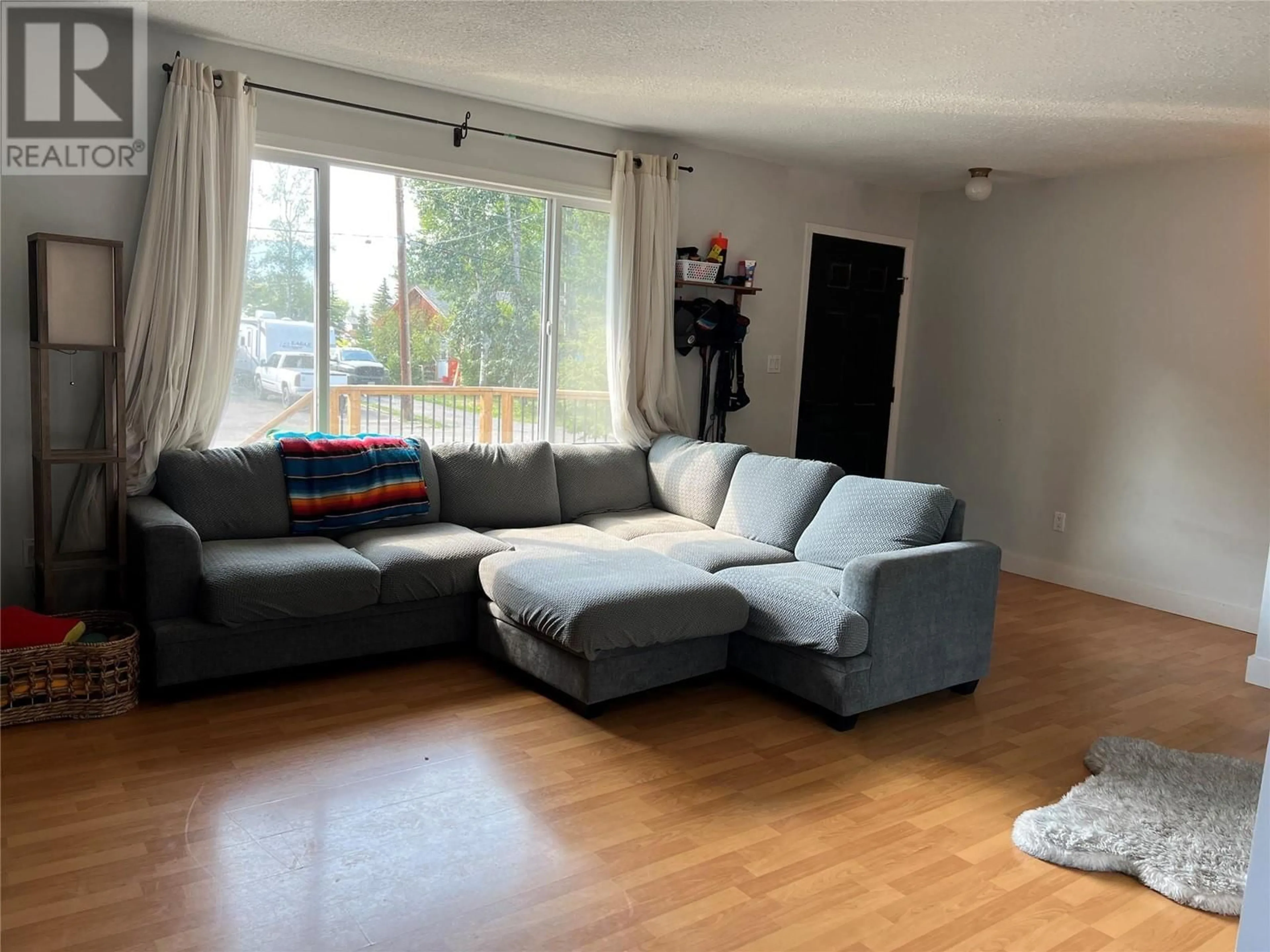 Living room with furniture, unknown for 5216 42 STREET NORTHEAST, Chetwynd British Columbia V0C1J0