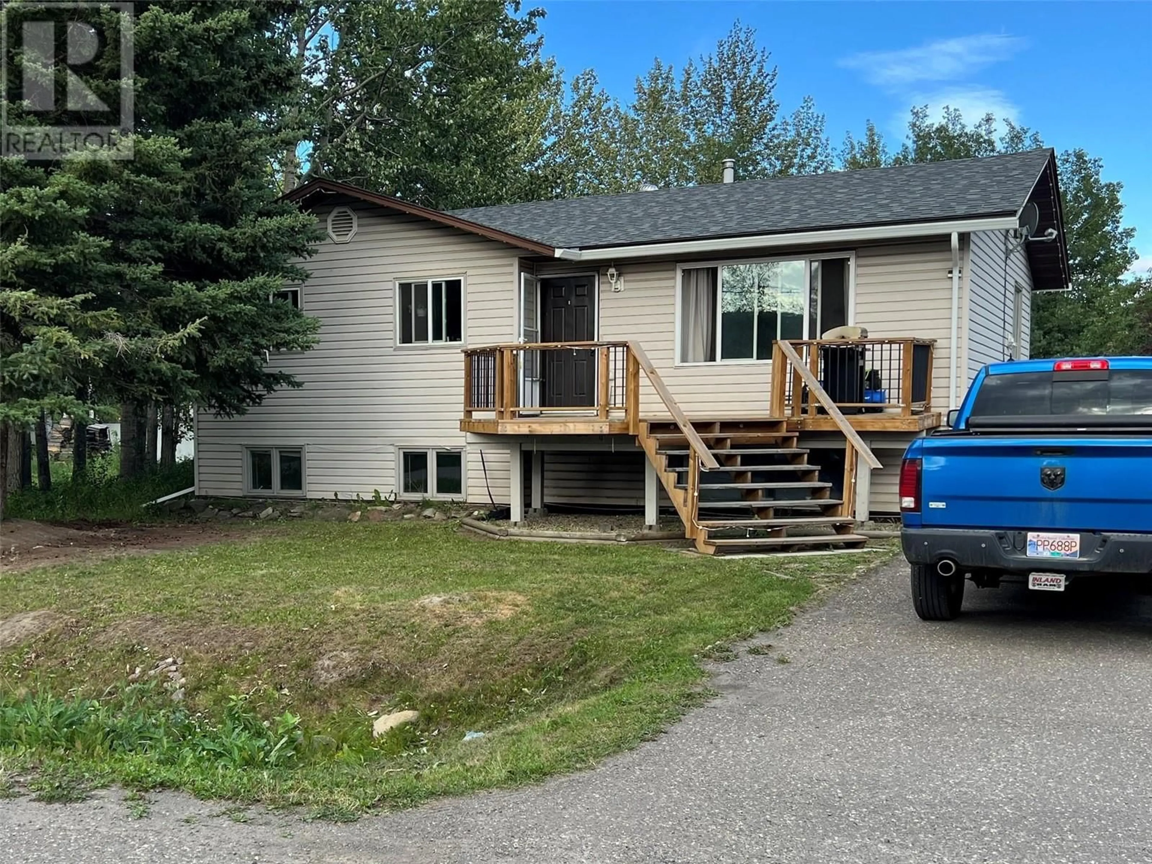 A pic from outside/outdoor area/front of a property/back of a property/a pic from drone, mountain view for 5216 42 Street NE, Chetwynd British Columbia V0C1J0