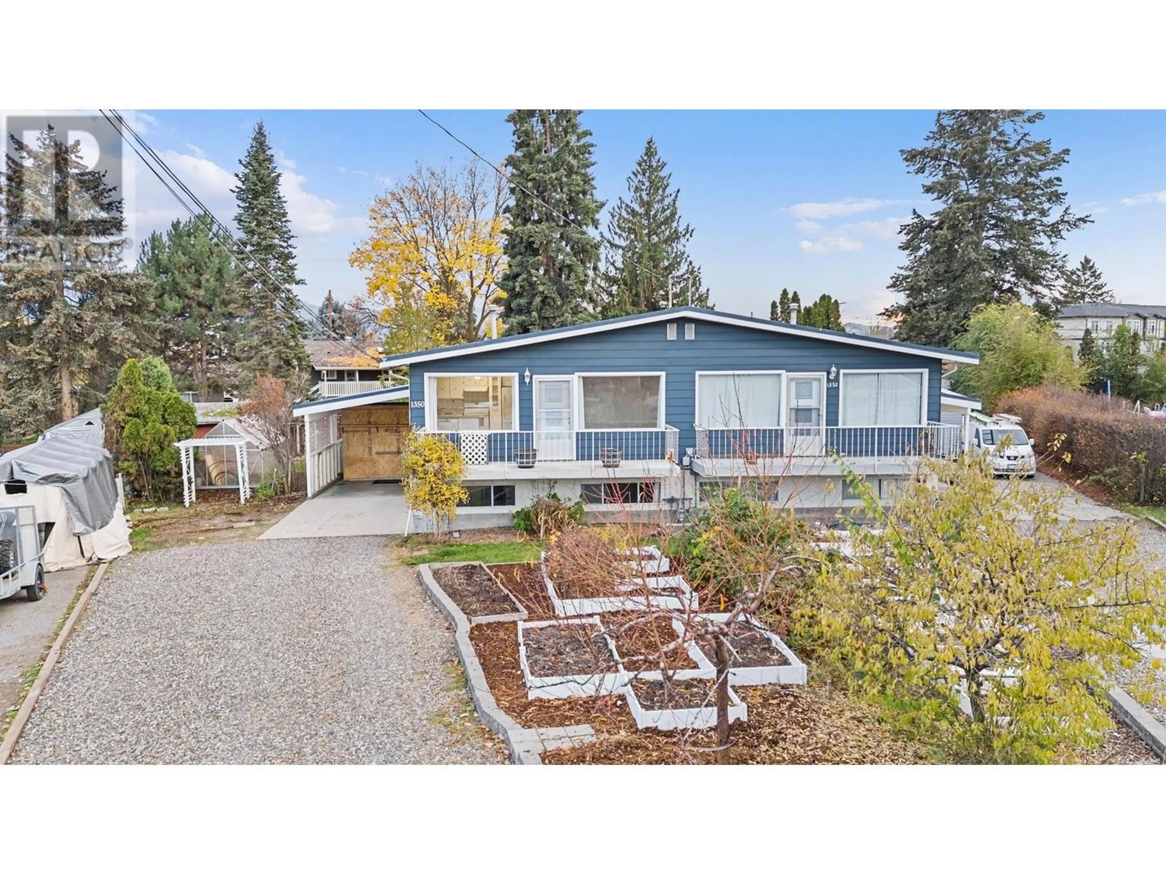 Home with vinyl exterior material, street for 1350 Maple Road, Kelowna British Columbia V1X4Y4