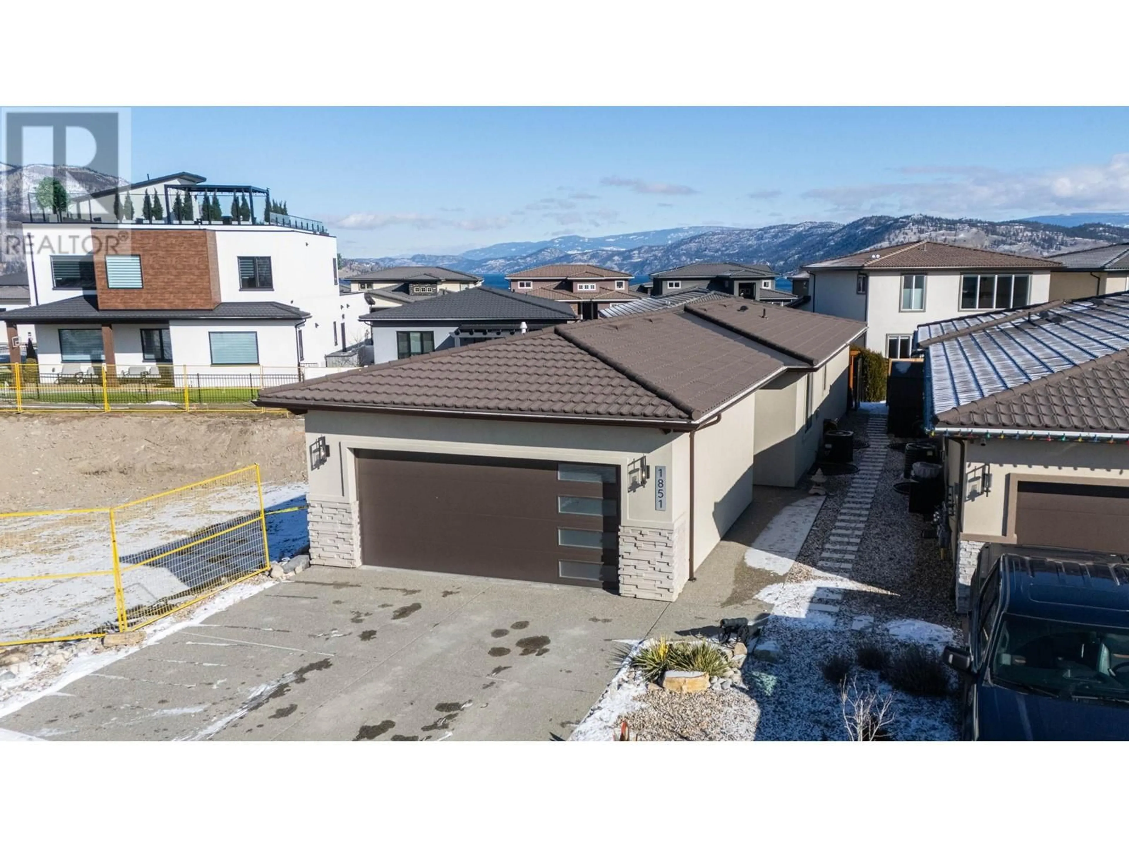 A pic from outside/outdoor area/front of a property/back of a property/a pic from drone, unknown for 1851 Viewpoint Crescent, Kelowna British Columbia V1Z4E1