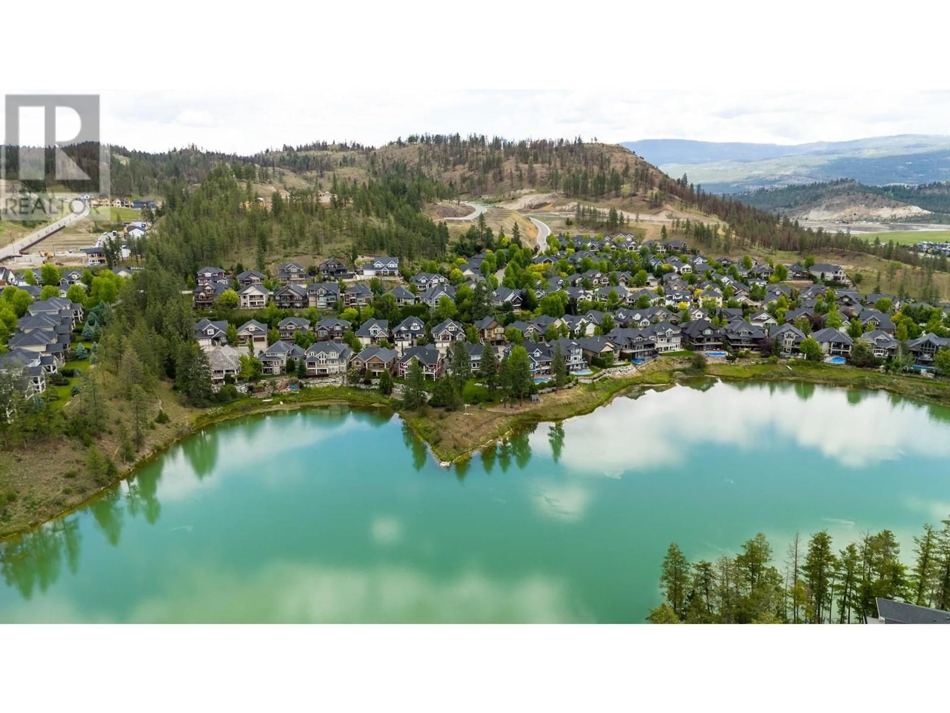 A pic from outside/outdoor area/front of a property/back of a property/a pic from drone, water/lake/river/ocean view for 1877 Begbie Road, Kelowna British Columbia V1V2X4