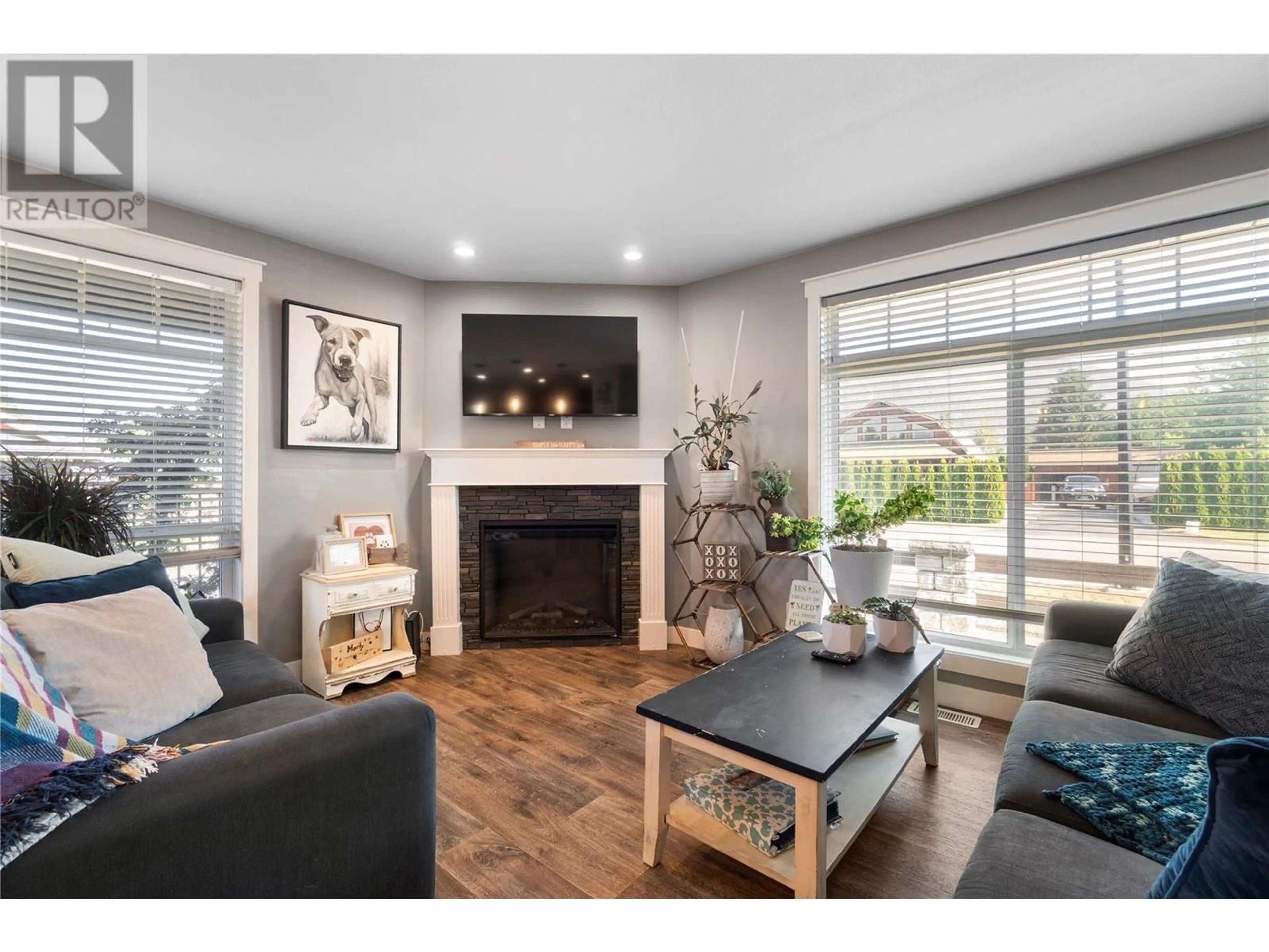 Living room with furniture, wood/laminate floor for 1137 Willow Row Street, Sicamous British Columbia V0E2V0