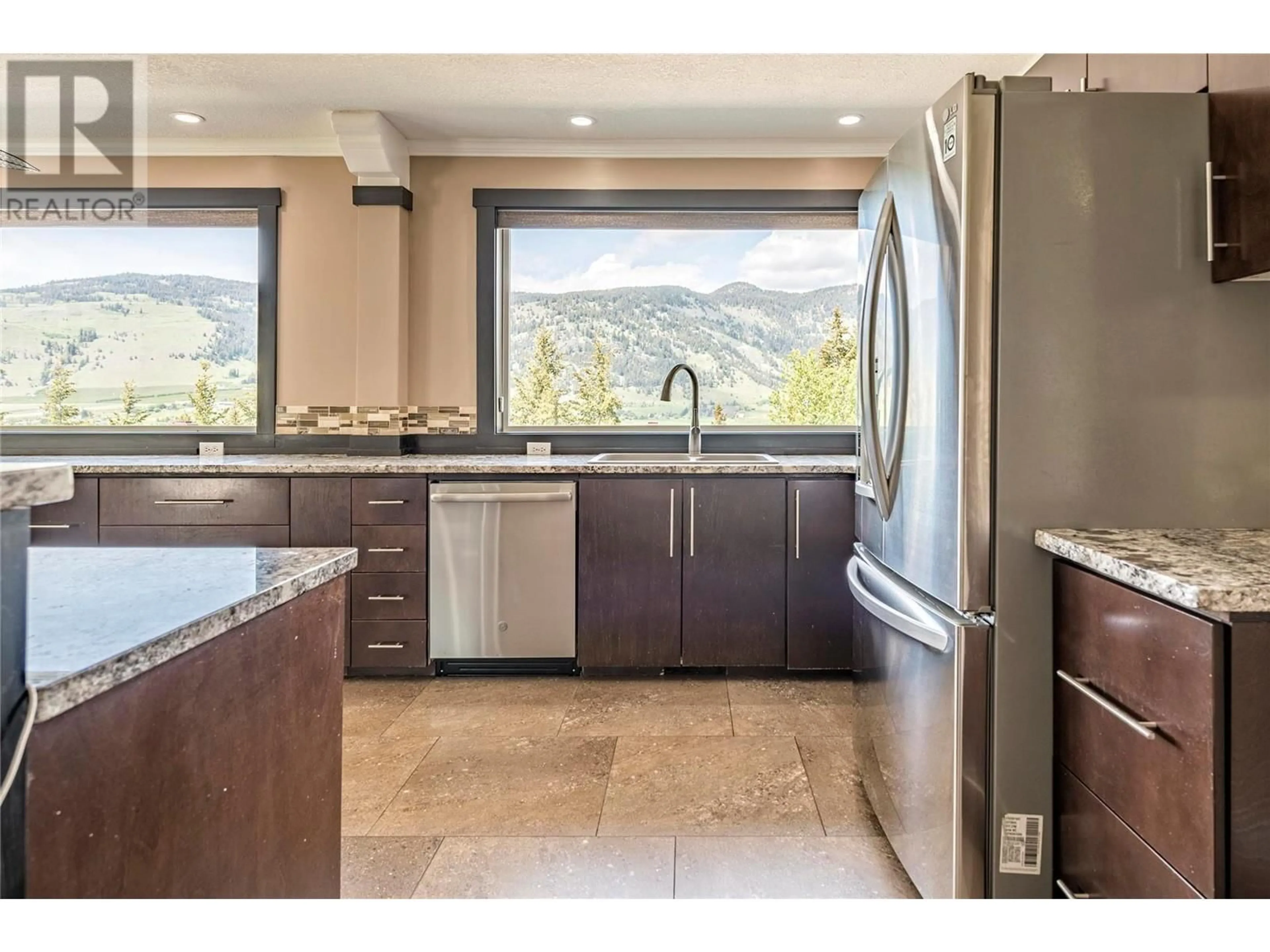 Open concept kitchen, ceramic/tile floor for 6660 Brewer Road, Coldstream British Columbia V1B3H2