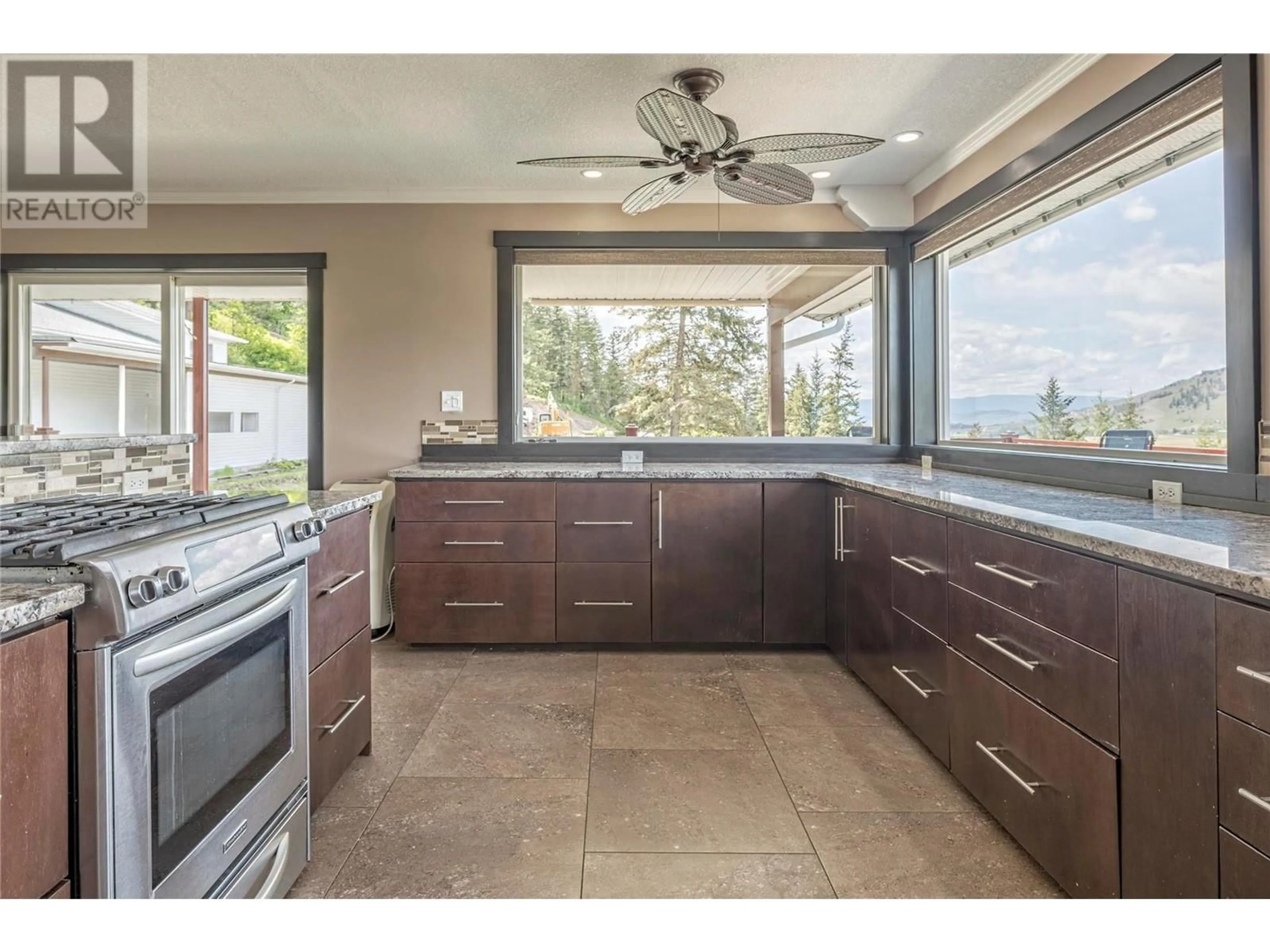 Open concept kitchen, ceramic/tile floor for 6660 Brewer Road, Coldstream British Columbia V1B3H2