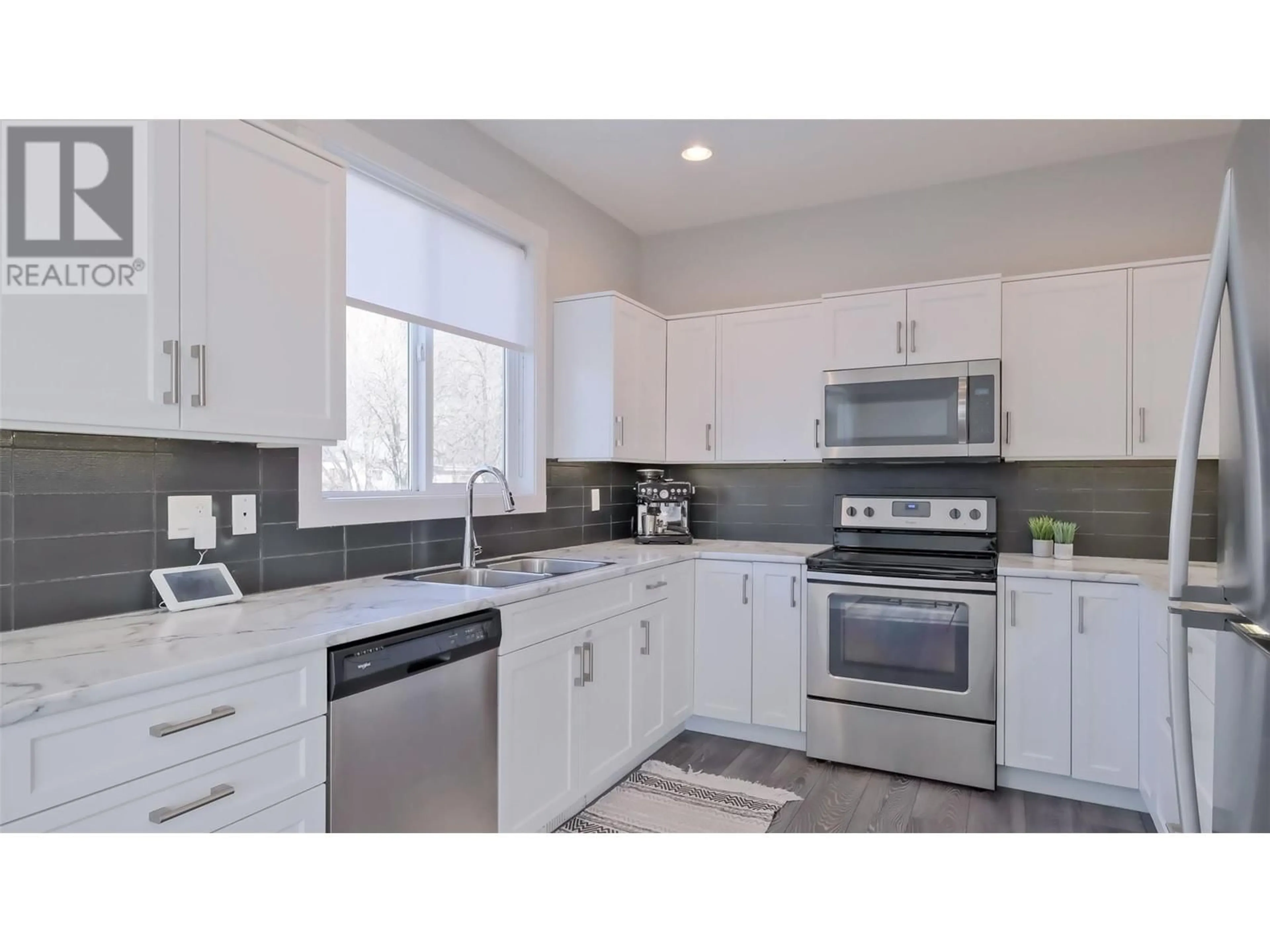 Open concept kitchen, ceramic/tile floor for 3909 30th Avenue Unit# 1, Vernon British Columbia V1T2G2