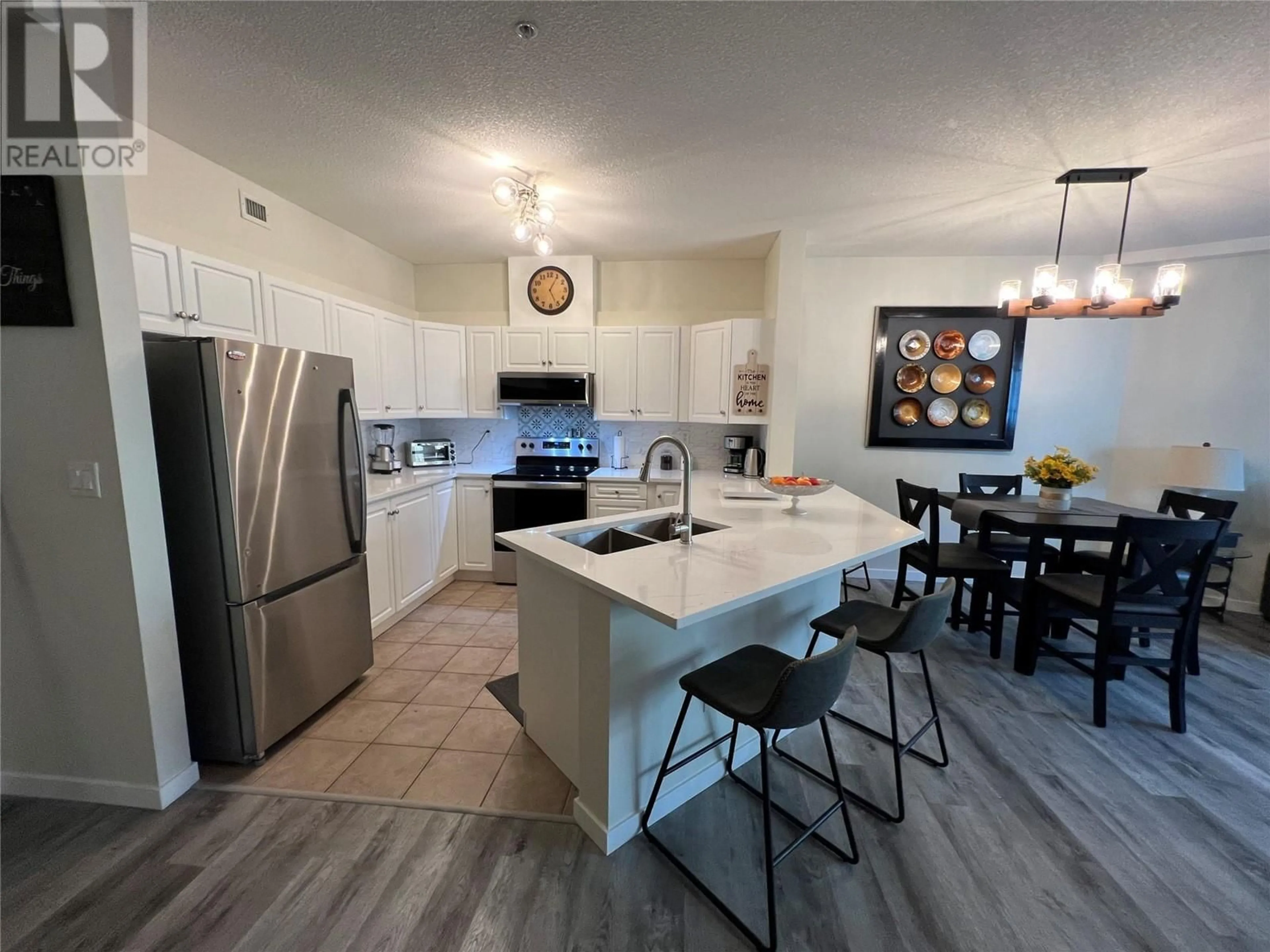 Open concept kitchen, ceramic/tile floor for 309 - 1088 SUNSET DRIVE, Kelowna British Columbia V1Y9W1