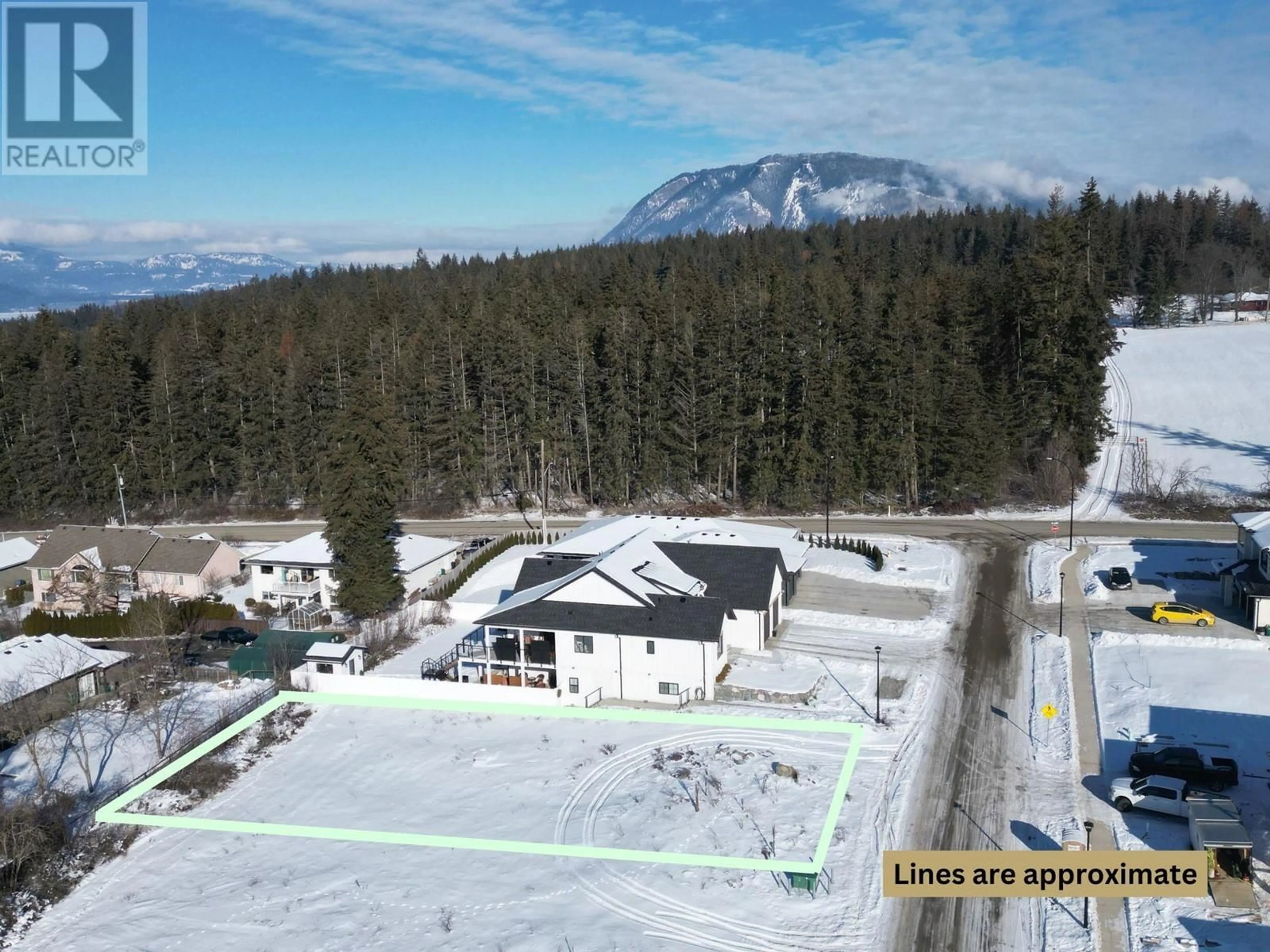 A pic from outside/outdoor area/front of a property/back of a property/a pic from drone, mountain view for 1905 35 Street NE, Salmon Arm British Columbia V1E1M9