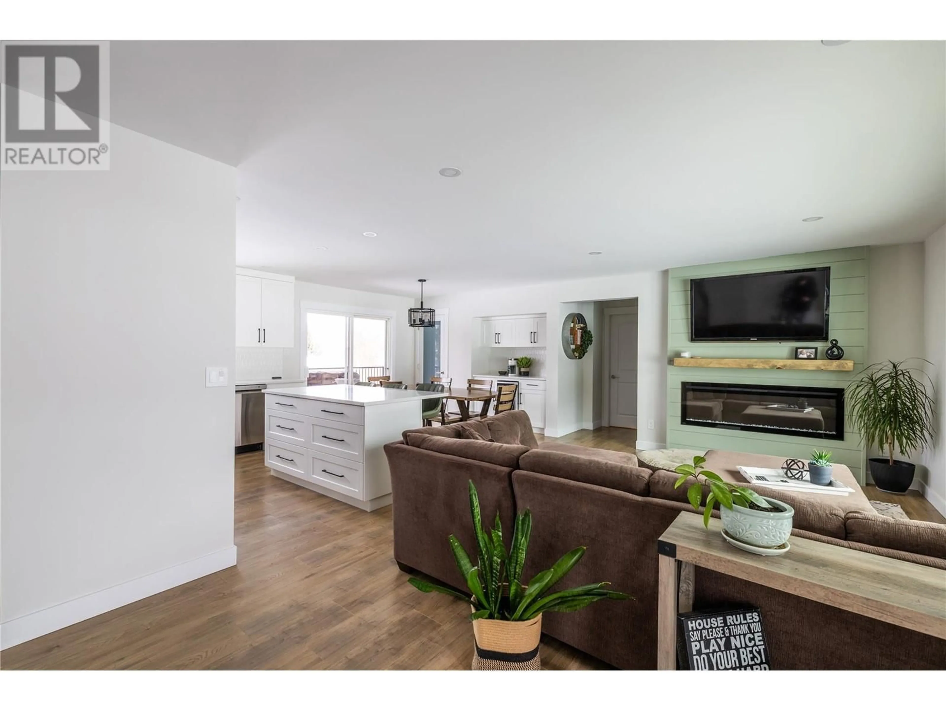 Open concept kitchen, wood/laminate floor for 6396 Meadowland Crescent N, Kamloops British Columbia V2C5J1