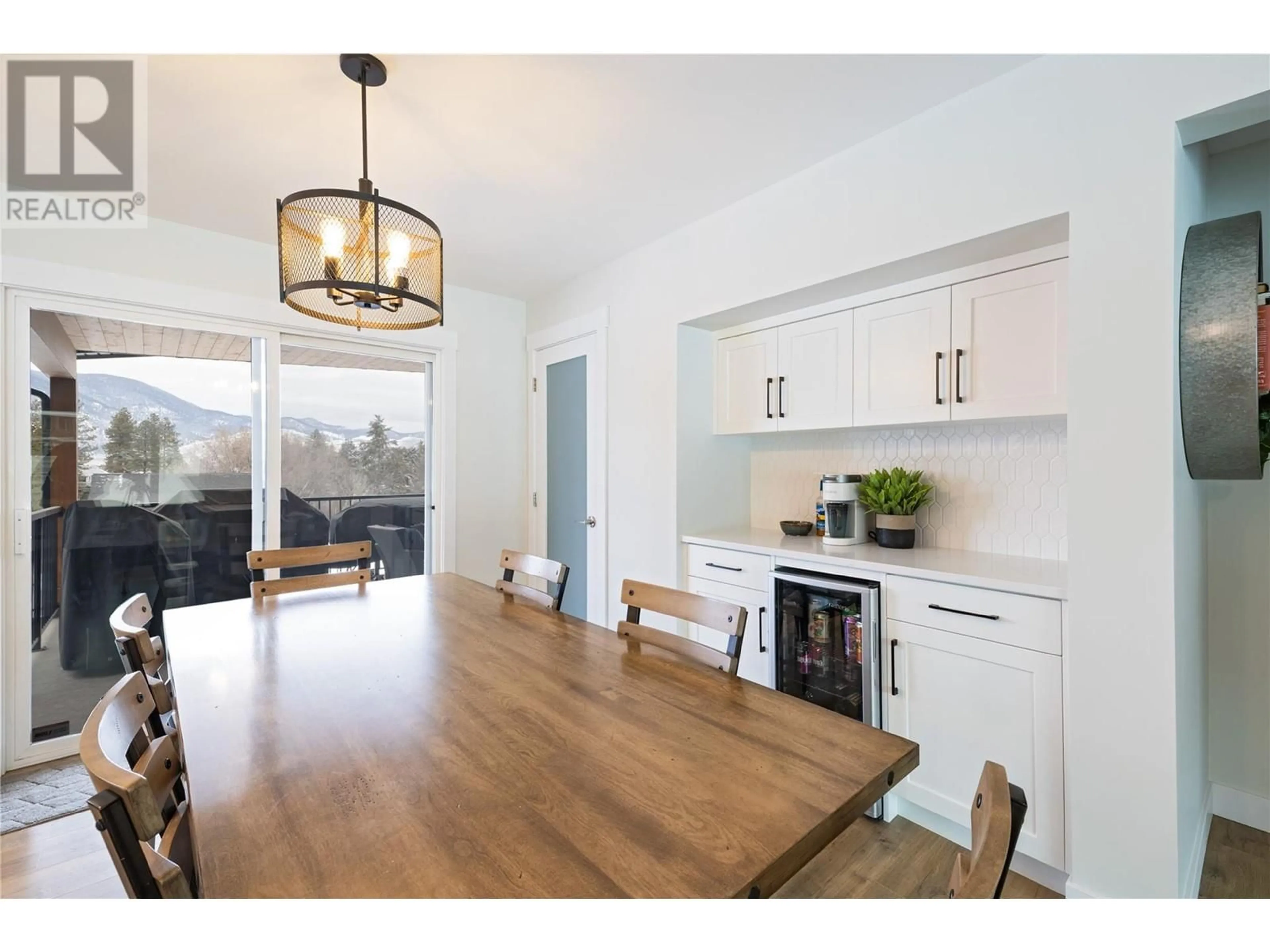 Open concept kitchen, wood/laminate floor for 6396 Meadowland Crescent N, Kamloops British Columbia V2C5J1