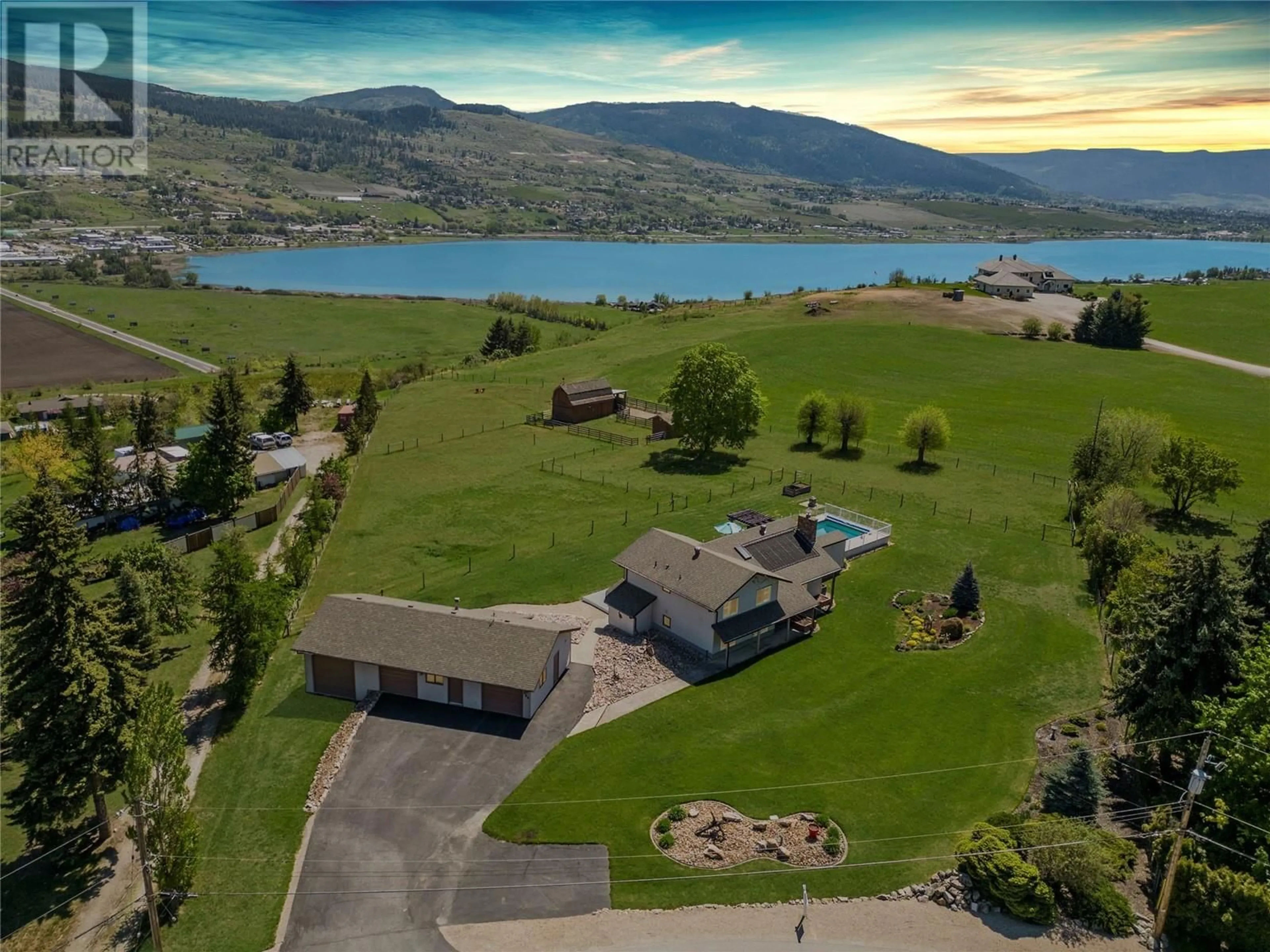 A pic from outside/outdoor area/front of a property/back of a property/a pic from drone, water/lake/river/ocean view for 186 Stepping Stones Crescent, Spallumcheen British Columbia V1H1X2