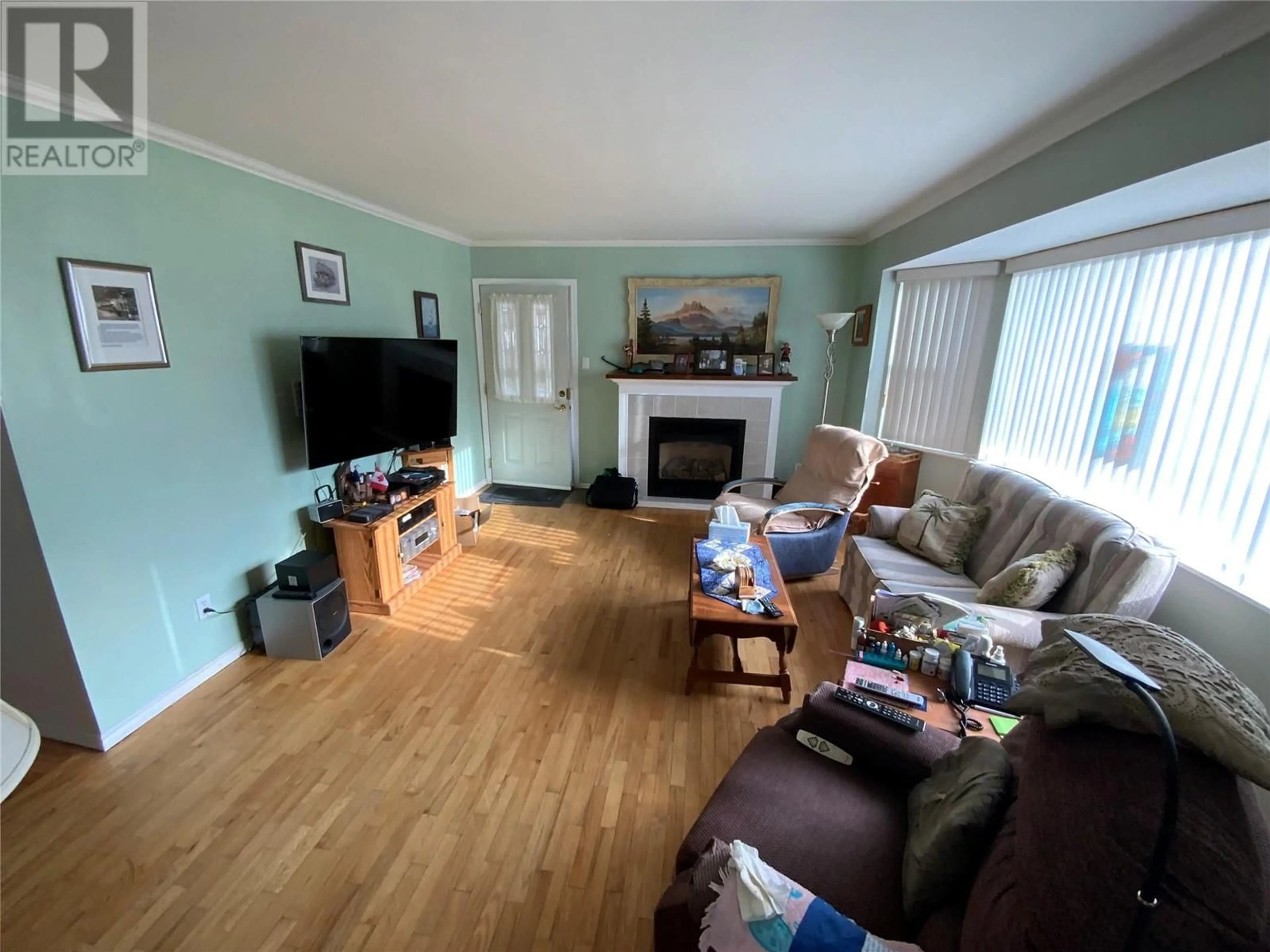 Living room with furniture, wood/laminate floor for 449 Conklin Avenue, Penticton British Columbia V2A2T3