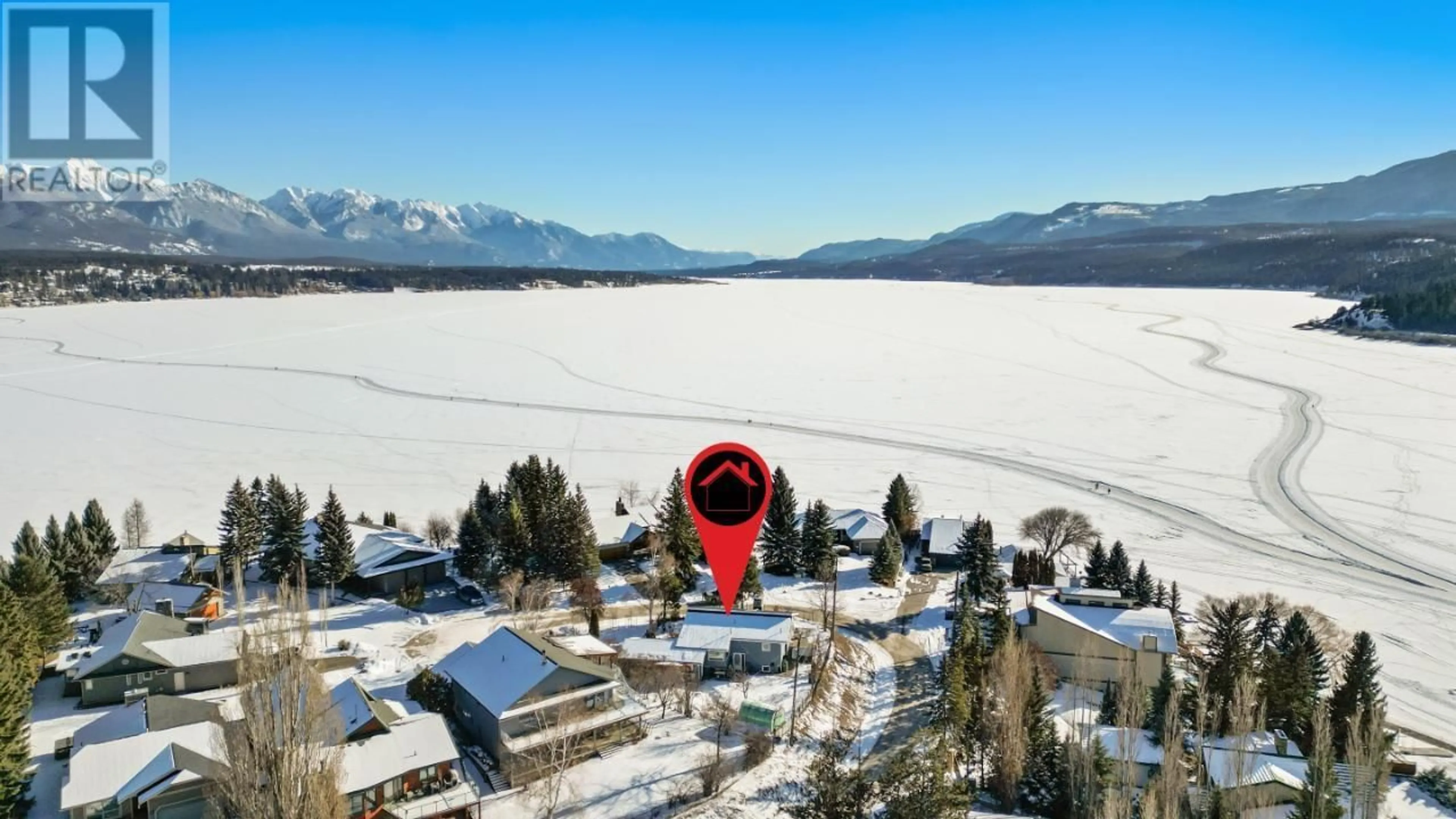 A pic from outside/outdoor area/front of a property/back of a property/a pic from drone, water/lake/river/ocean view for 1751 FORT POINT Close, Invermere British Columbia V0A1K0