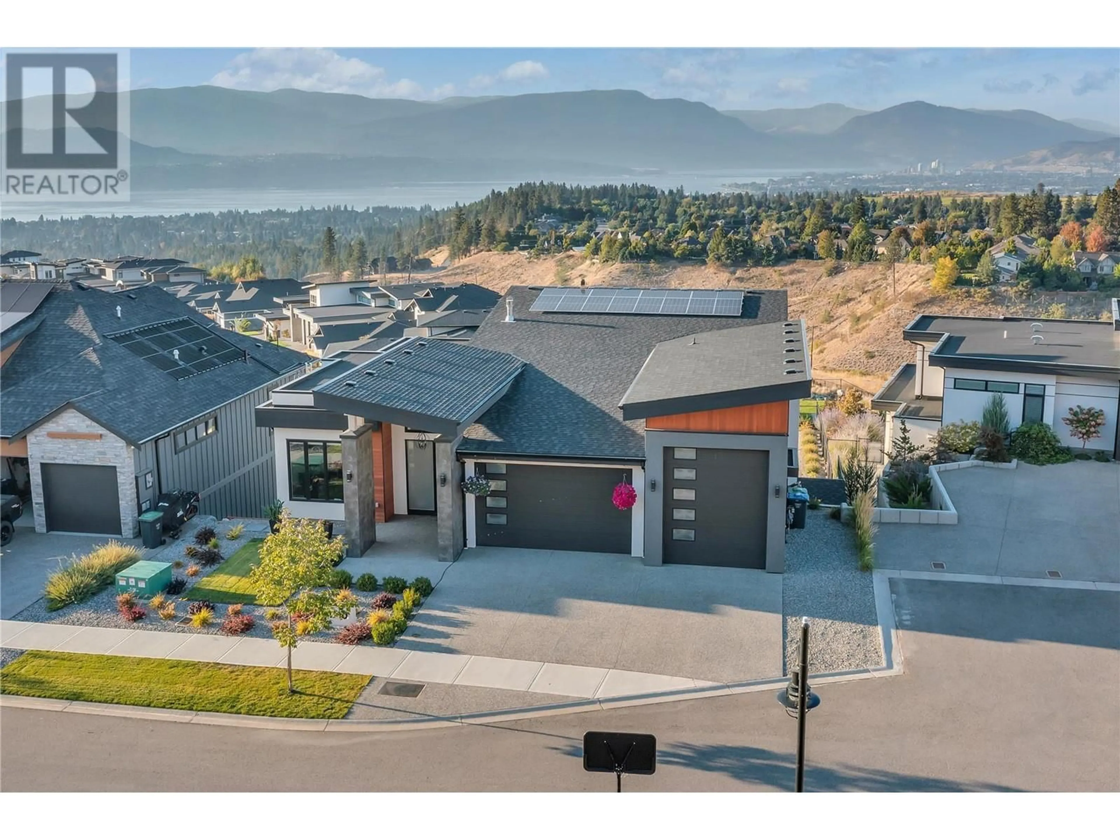 A pic from outside/outdoor area/front of a property/back of a property/a pic from drone, mountain view for 1710 Fawn Run Court, Kelowna British Columbia V1W4A2