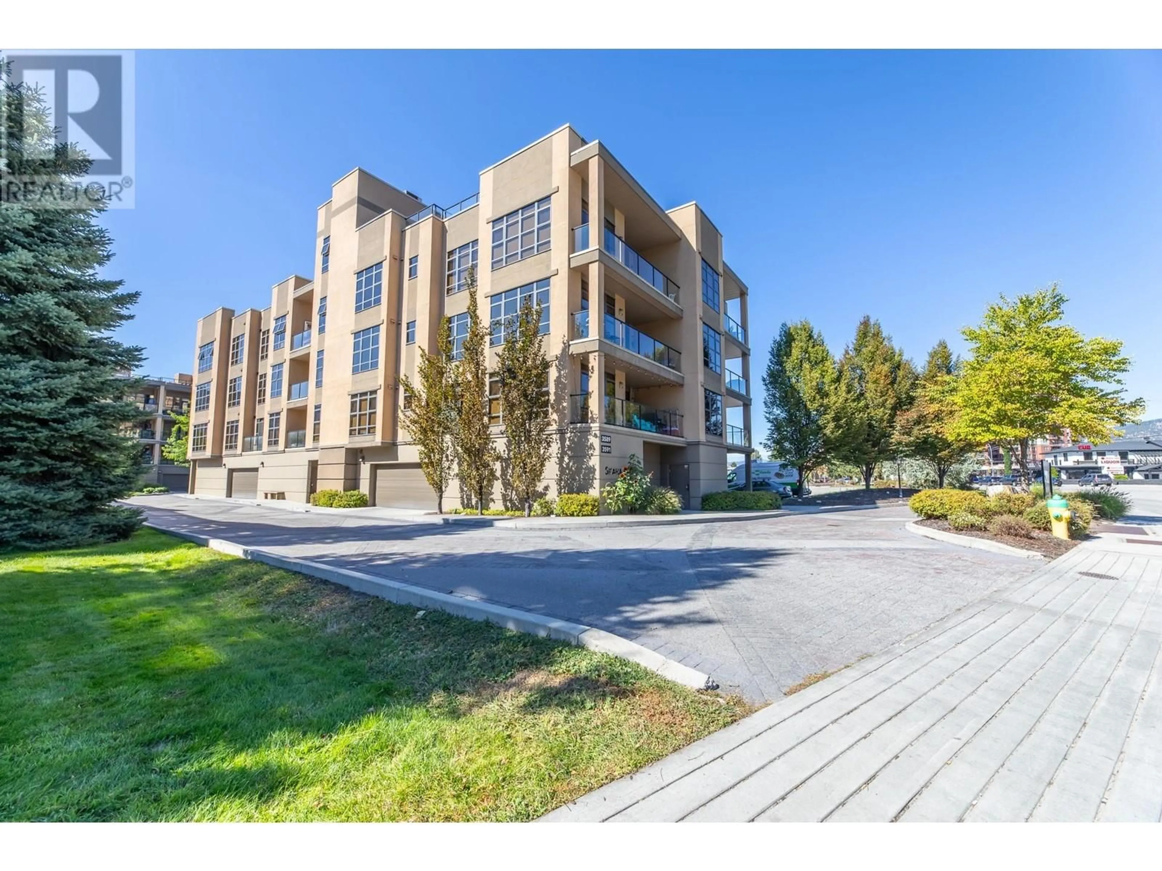 A pic from outside/outdoor area/front of a property/back of a property/a pic from drone, building for 3589 Skaha Lake Road Unit# 404, Penticton British Columbia V2A7K2