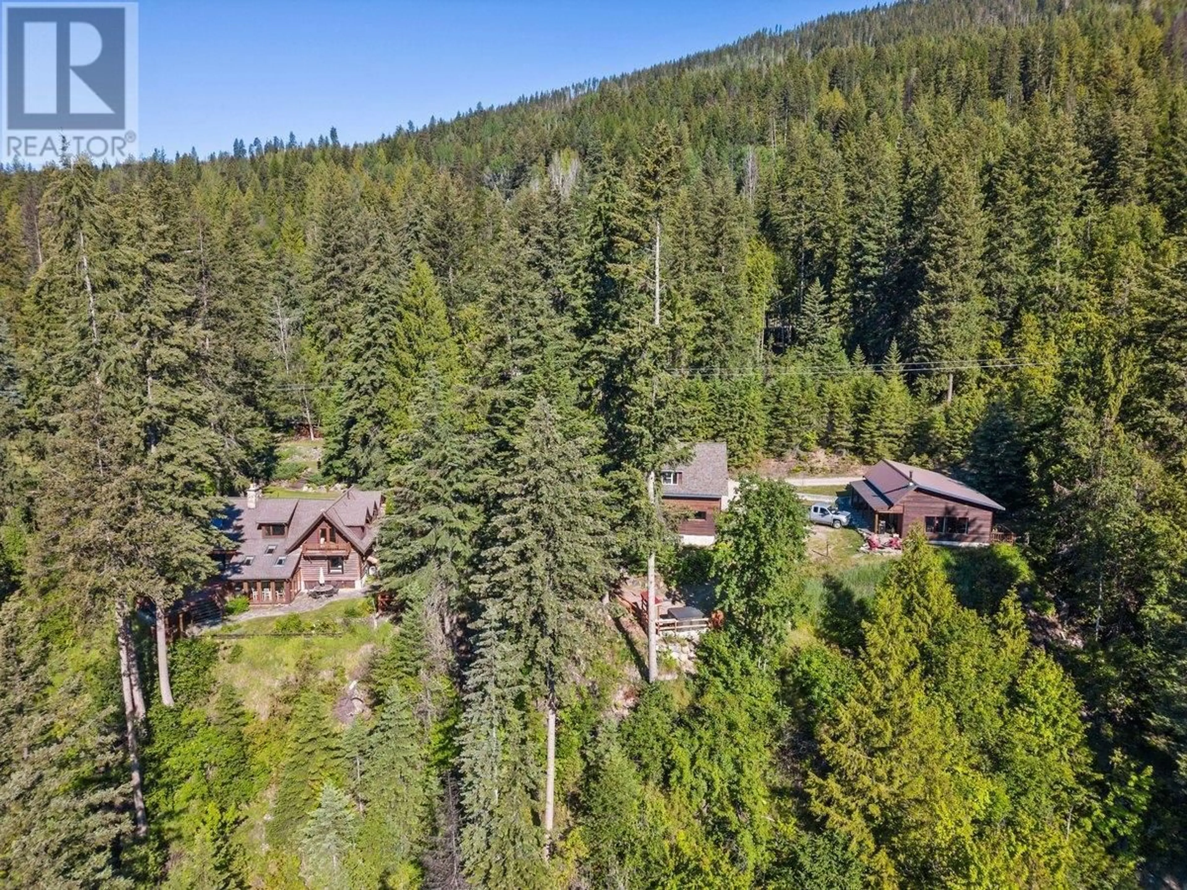 A pic from outside/outdoor area/front of a property/back of a property/a pic from drone, forest/trees view for 4898 3A Highway, Beasley British Columbia V0G2G2