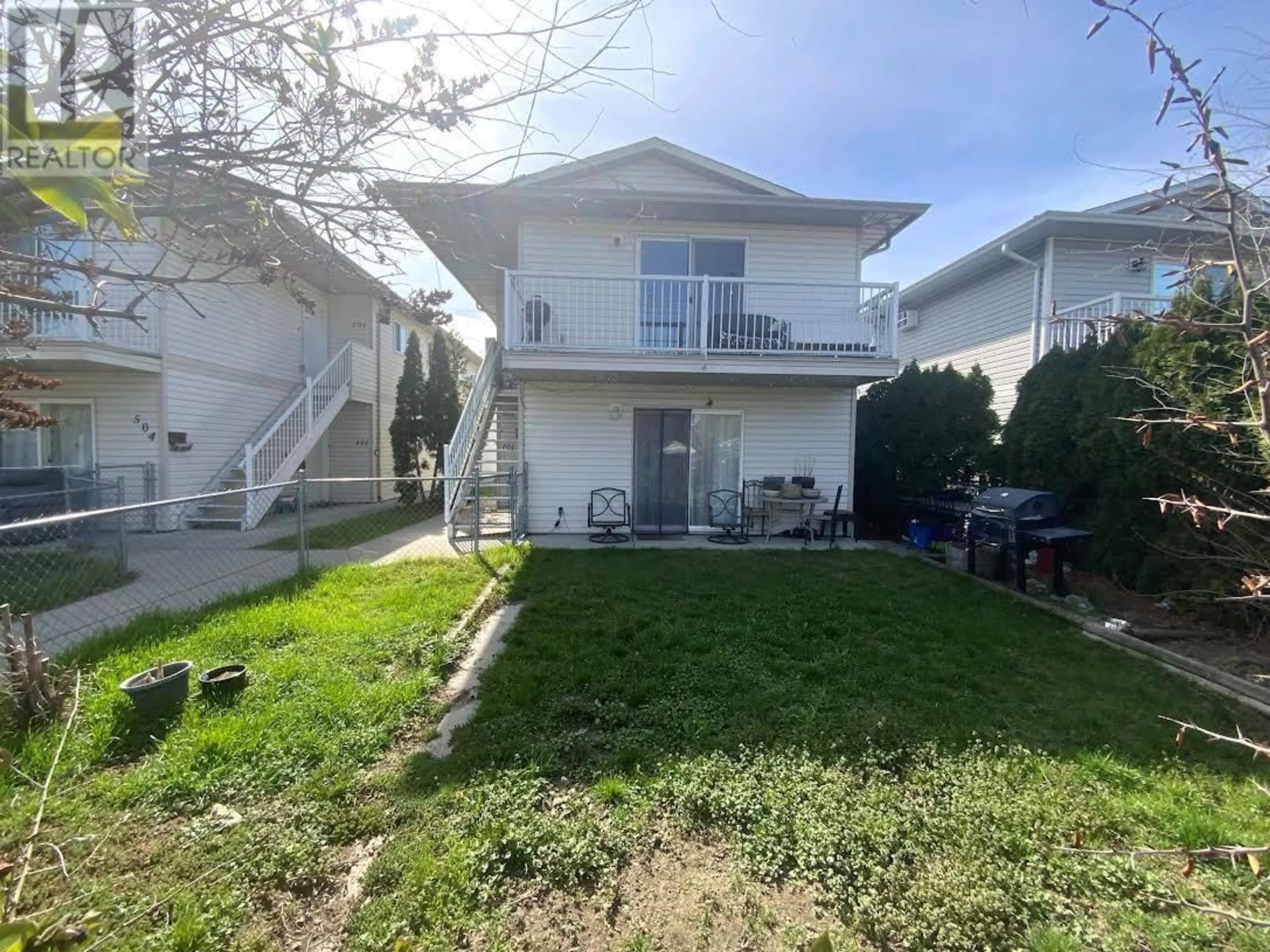 A pic from outside/outdoor area/front of a property/back of a property/a pic from drone, street for 516 Wade Avenue Unit# 201, Penticton British Columbia V2A1V5