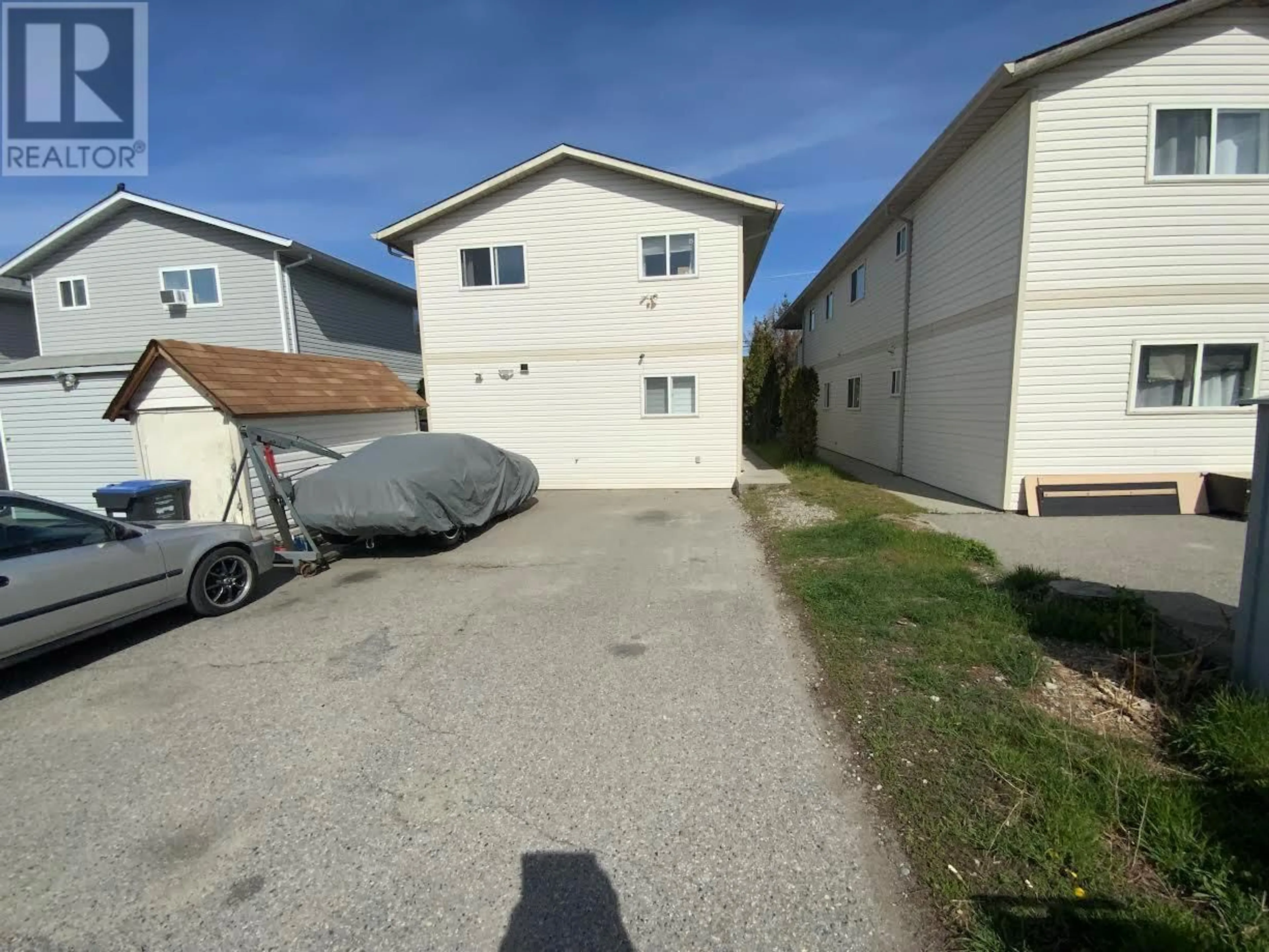 A pic from outside/outdoor area/front of a property/back of a property/a pic from drone, street for 516 Wade Avenue Unit# 201, Penticton British Columbia V2A1V5