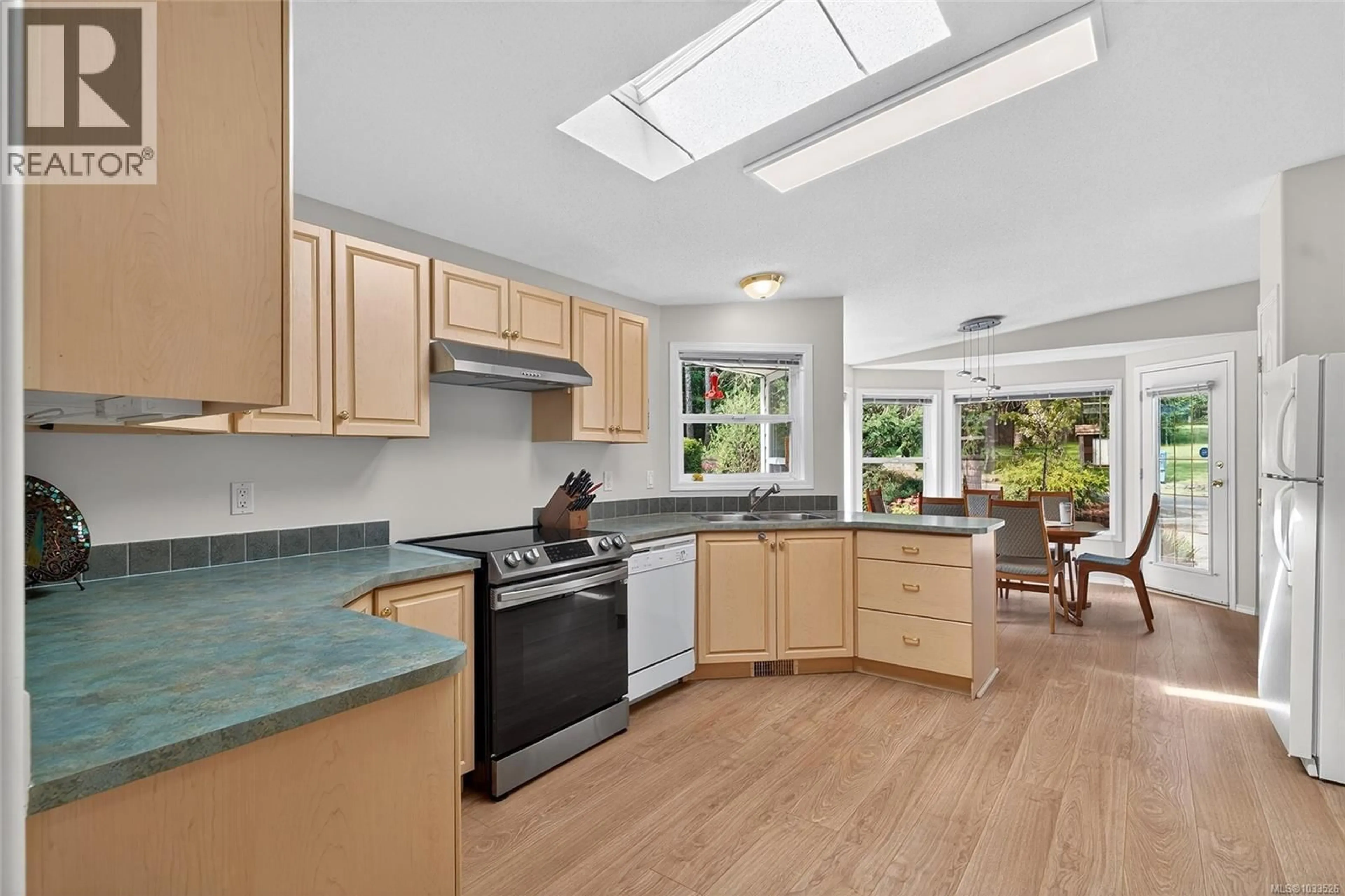 Open concept kitchen, ceramic/tile floor for 103 - 1391 PRICE ROAD, Errington British Columbia V9P2W1