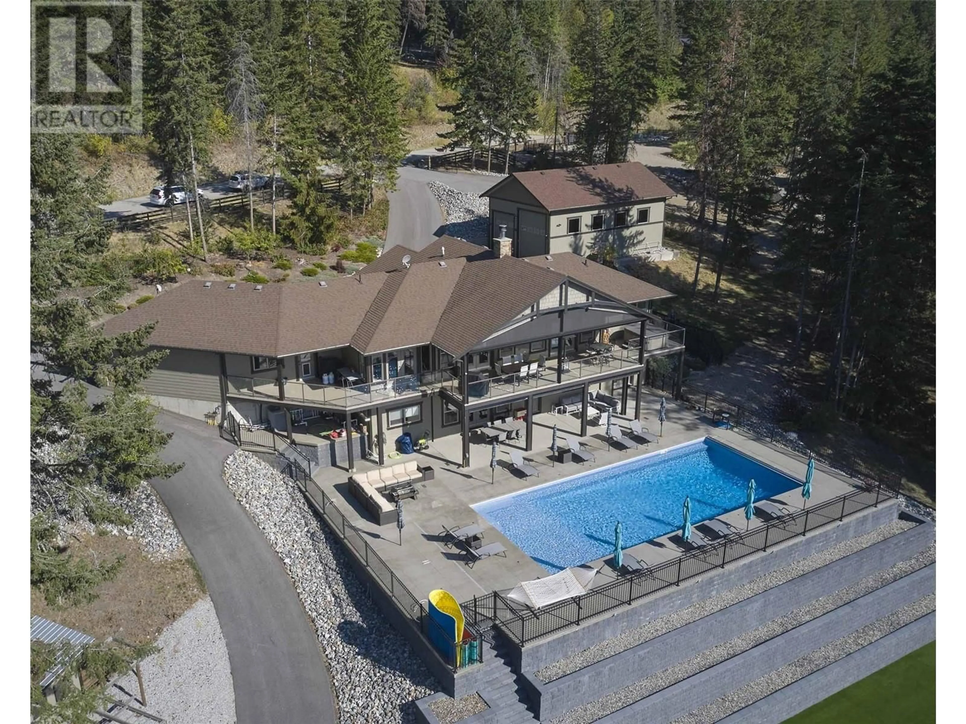 A pic from outside/outdoor area/front of a property/back of a property/a pic from drone, mountain view for 6032 Lynx Drive, Vernon British Columbia V1B3J5