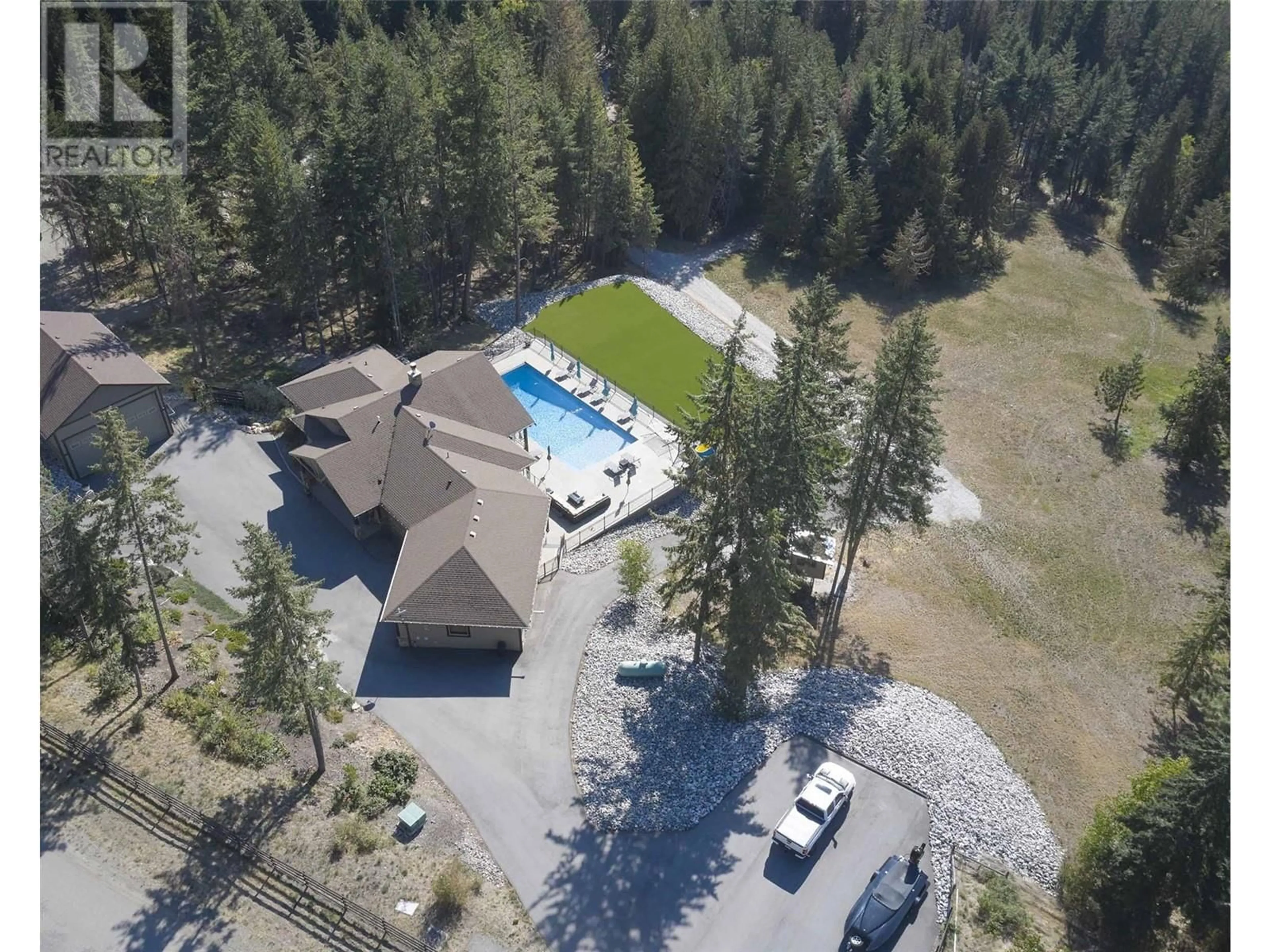 A pic from outside/outdoor area/front of a property/back of a property/a pic from drone, unknown for 6032 Lynx Drive, Vernon British Columbia V1B3J5