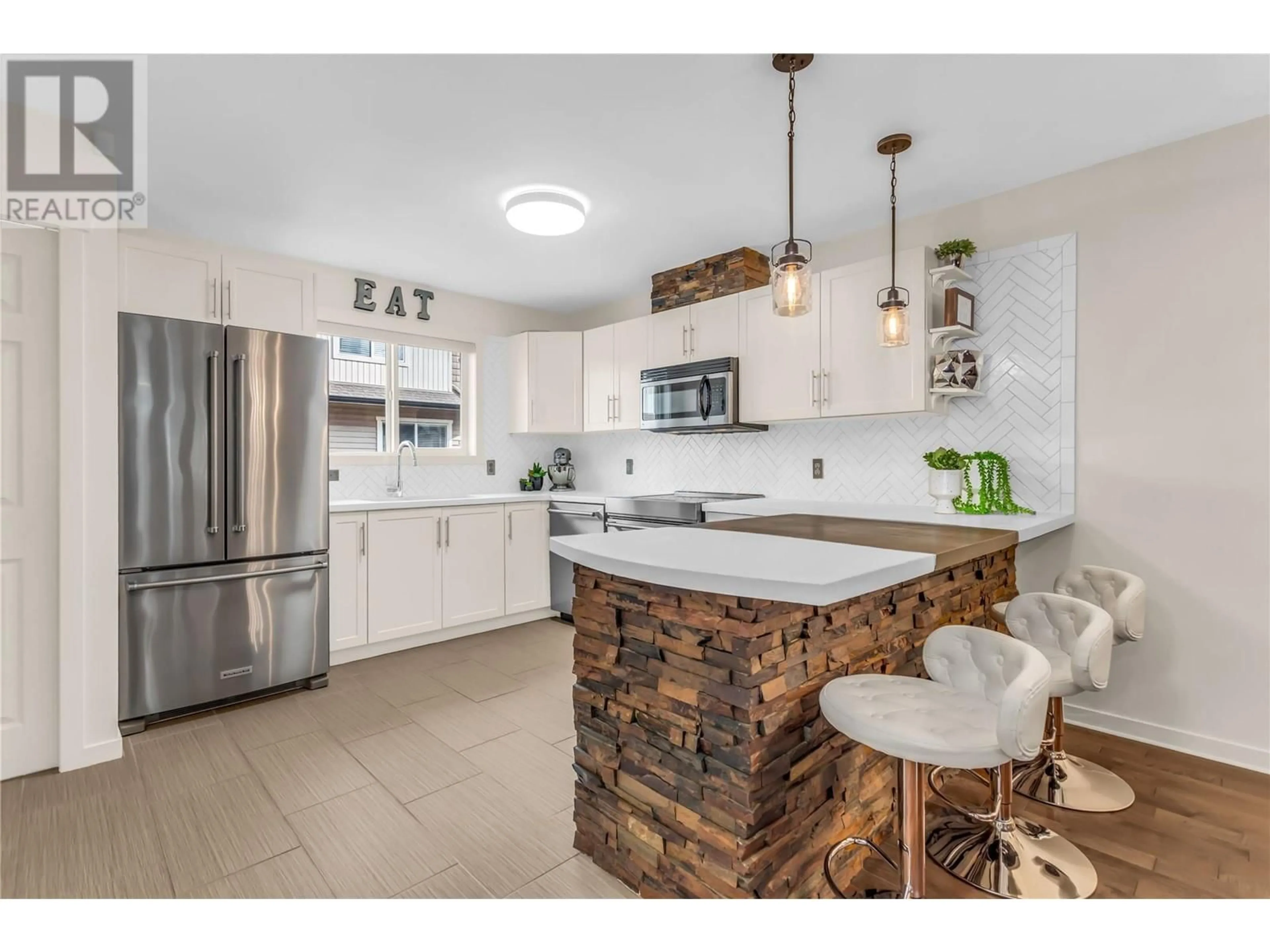 Open concept kitchen, ceramic/tile floor for 122 - 1355 FINDLAY ROAD, Kelowna British Columbia V1X8B8