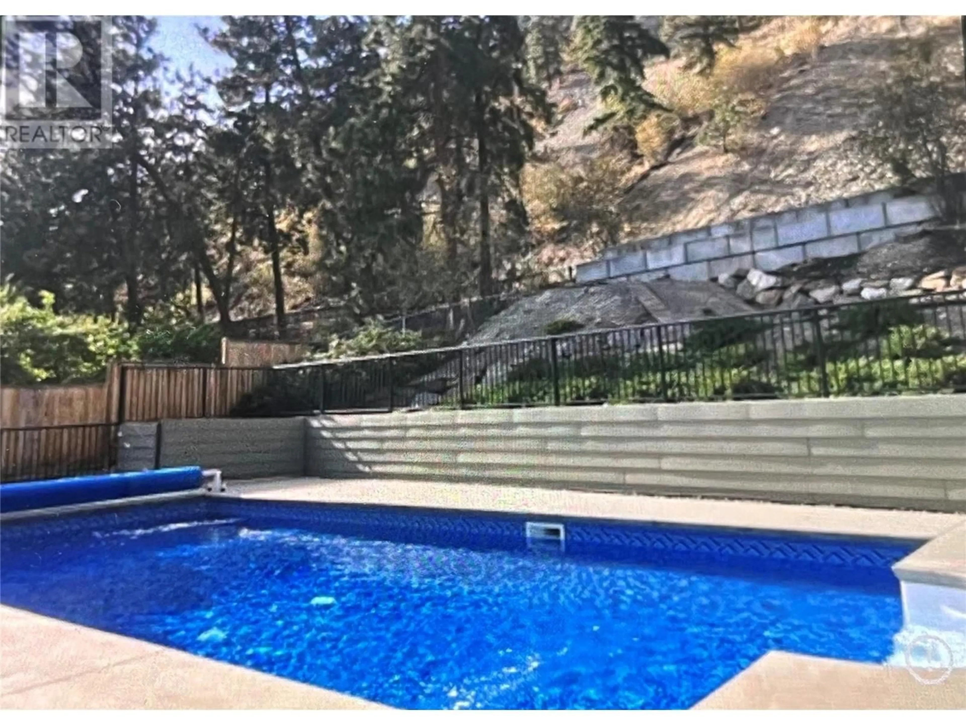 A pic from outside/outdoor area/front of a property/back of a property/a pic from drone, unknown for 2218 OMINECA PLACE, Kelowna British Columbia V1V1H7