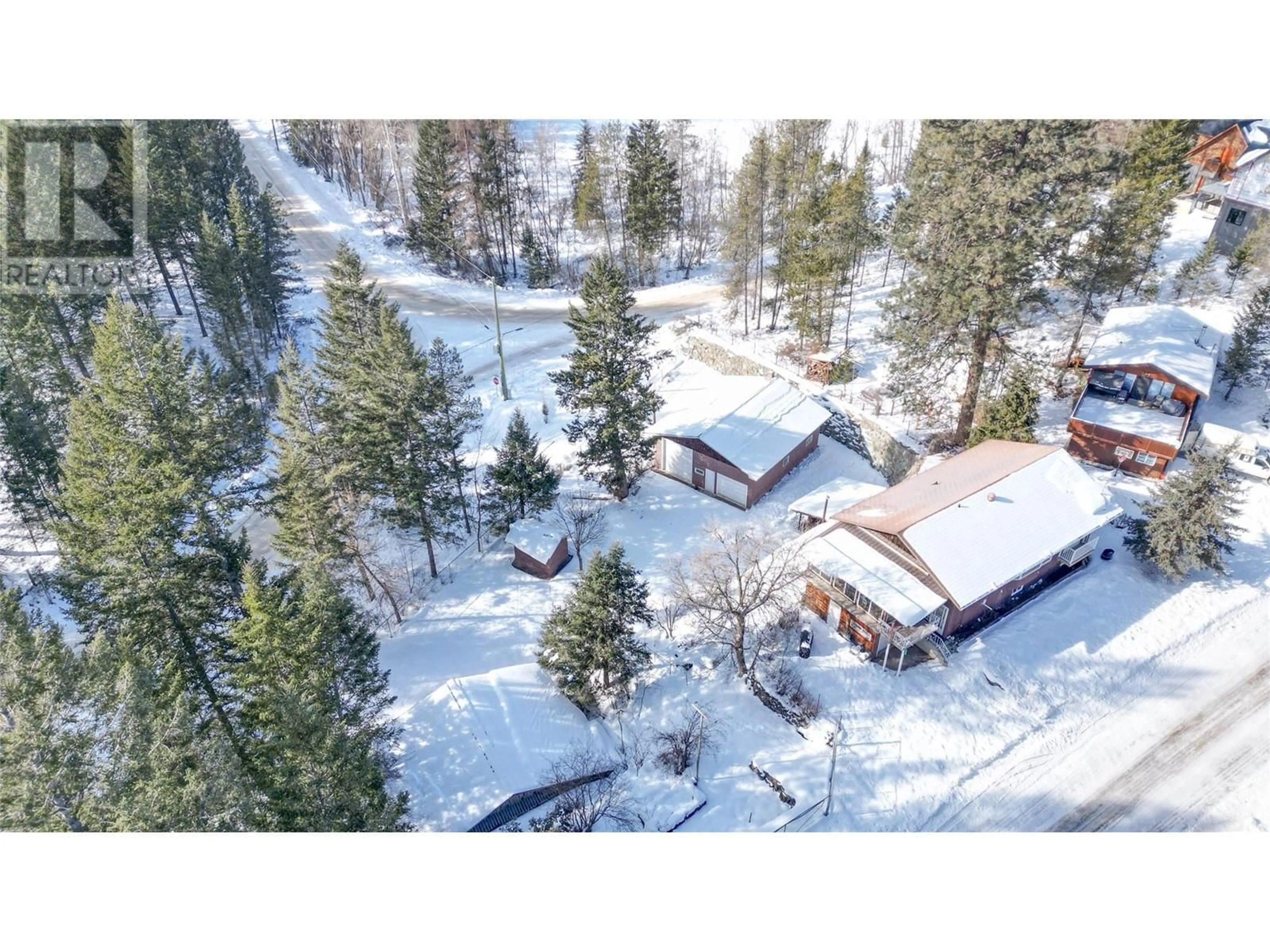A pic from outside/outdoor area/front of a property/back of a property/a pic from drone, mountain view for 6835 ROSEN LAKE ROAD, Jaffray British Columbia V0B1T0