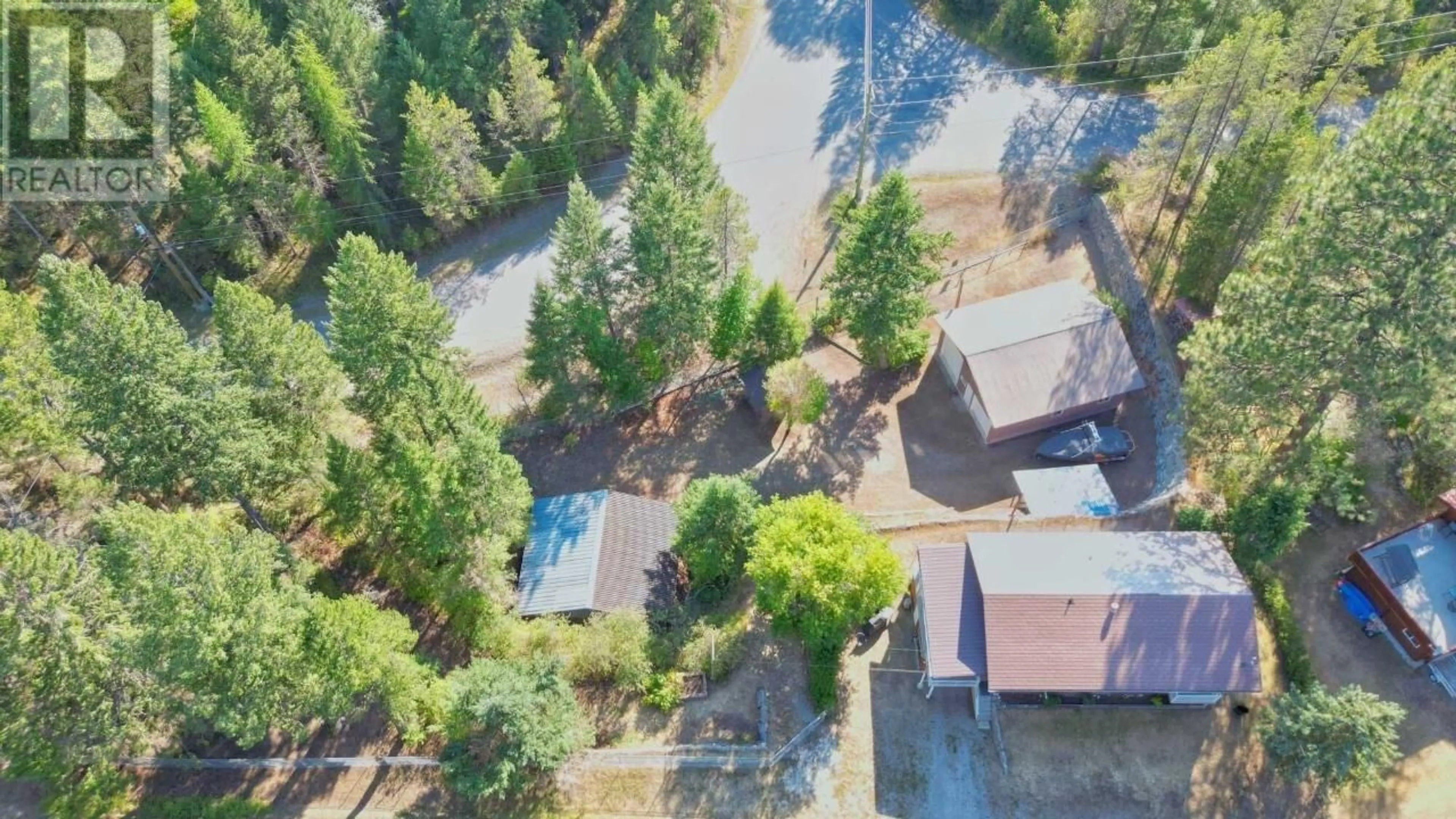 A pic from outside/outdoor area/front of a property/back of a property/a pic from drone, forest/trees view for 6835 ROSEN LAKE ROAD, Jaffray British Columbia V0B1T0