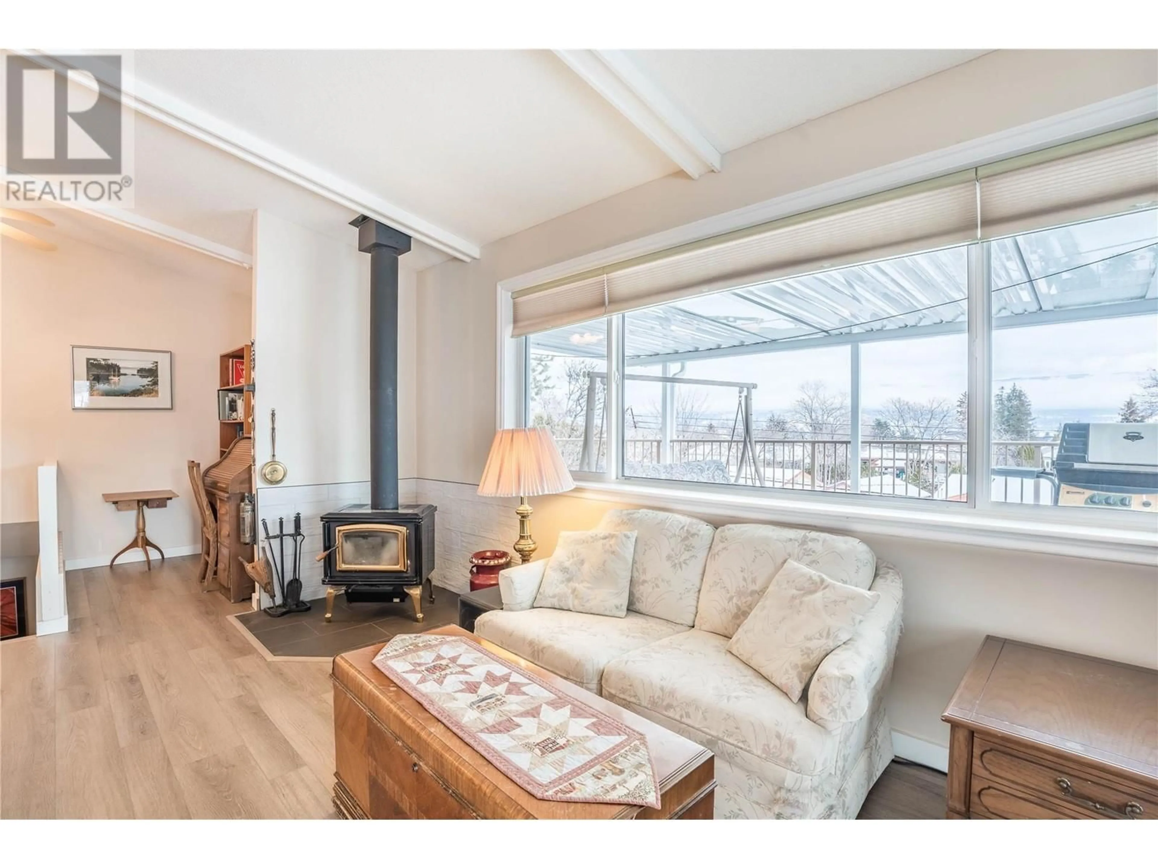 Living room with furniture, wood/laminate floor for 12406 Wright Avenue, Summerland British Columbia V0H1Z0