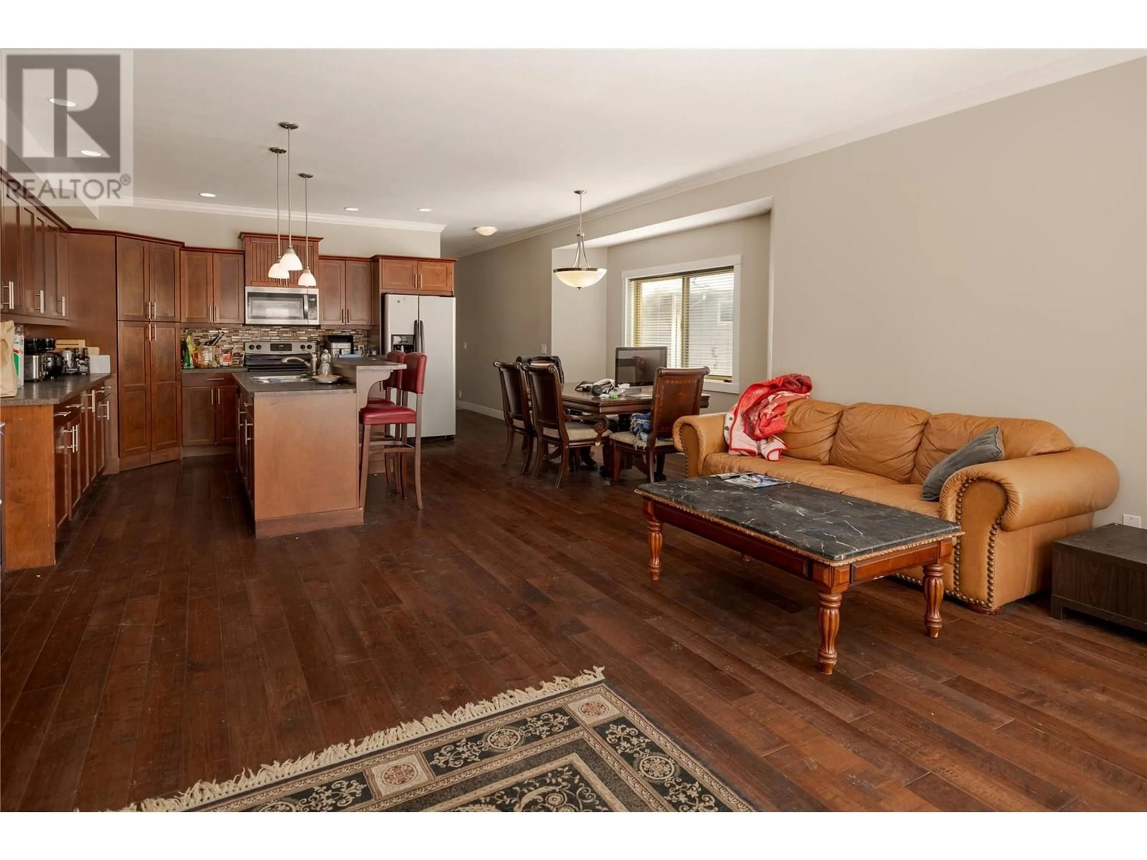 Open concept kitchen, wood/laminate floor for A - 10392 BOTTOM WOOD LAKE ROAD, Lake Country British Columbia V4V1T9