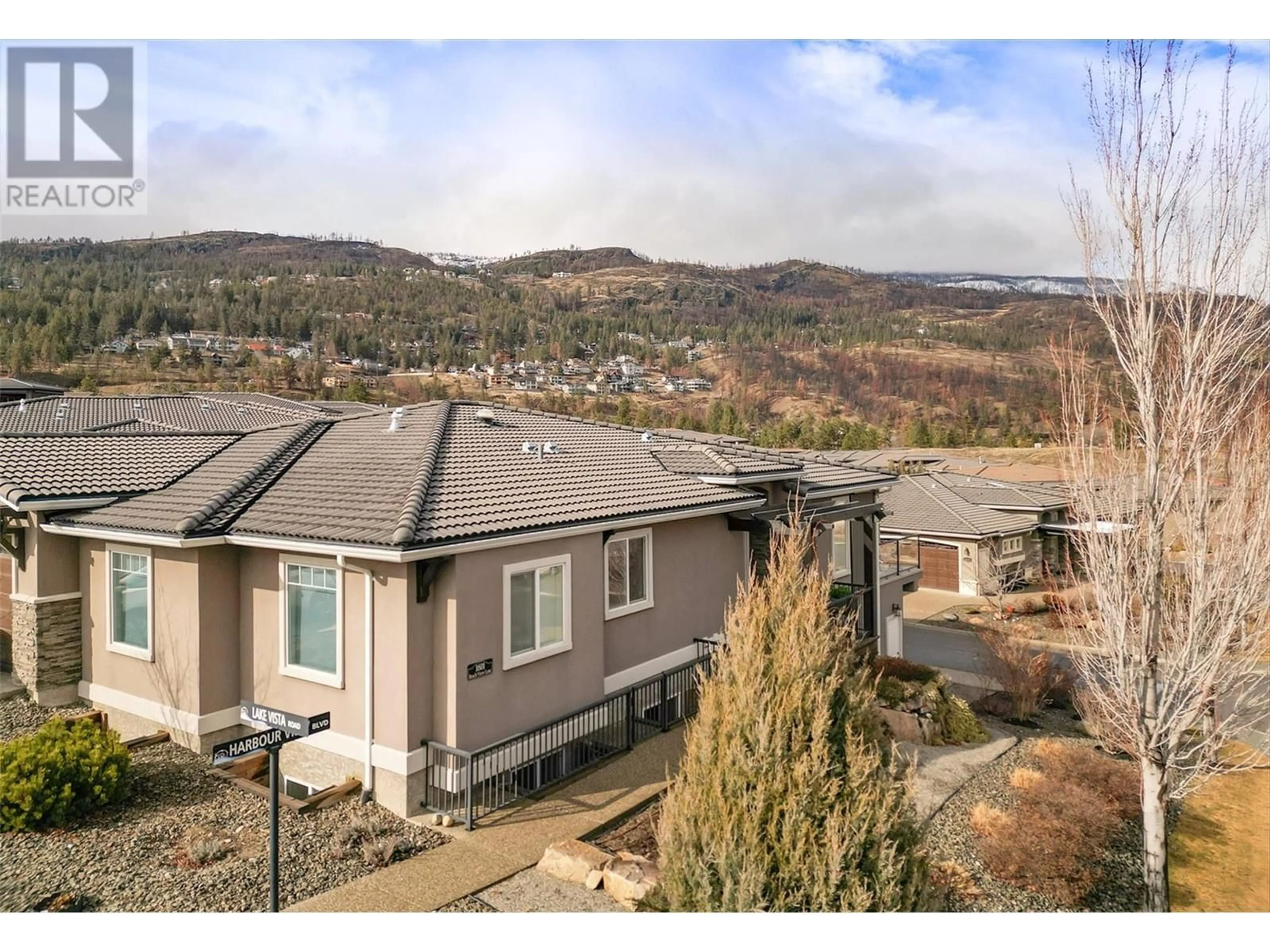 A pic from outside/outdoor area/front of a property/back of a property/a pic from drone, mountain view for 1601 Beach View Lane, Kelowna British Columbia V1Z4E1