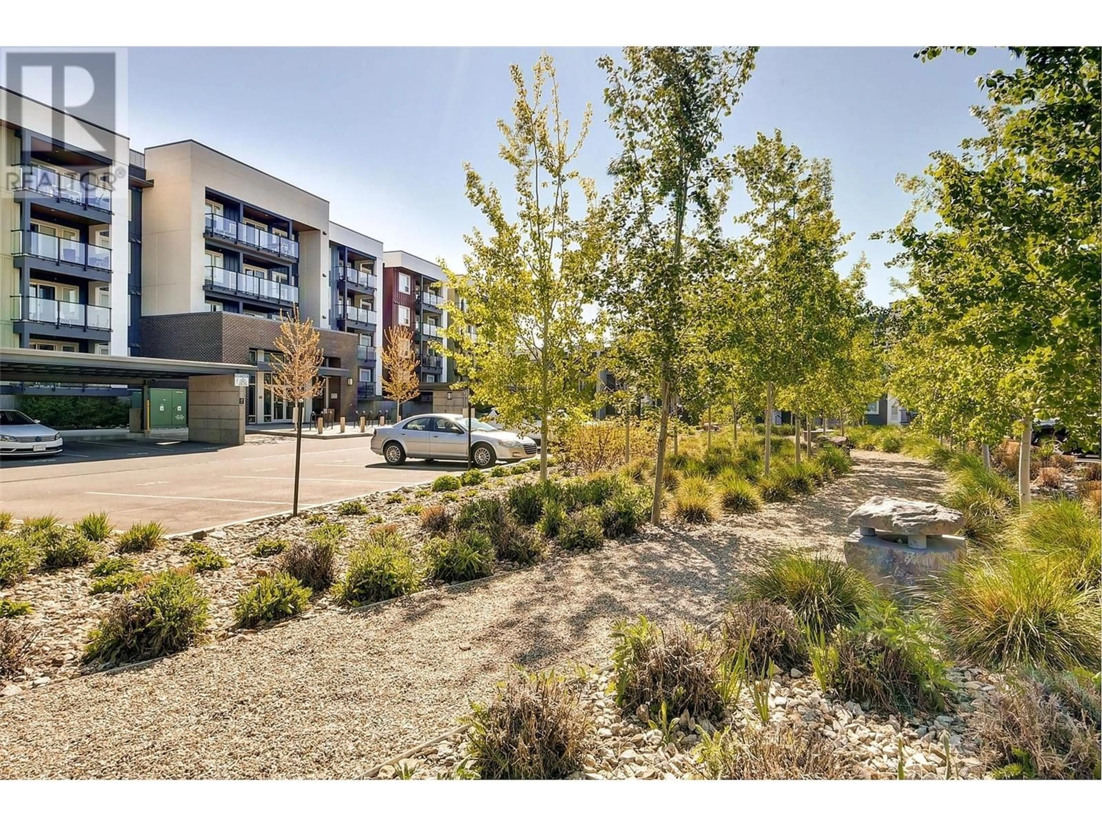 A pic from outside/outdoor area/front of a property/back of a property/a pic from drone, street for 121 - 775 ACADEMY WAY, Kelowna British Columbia V1V0A5