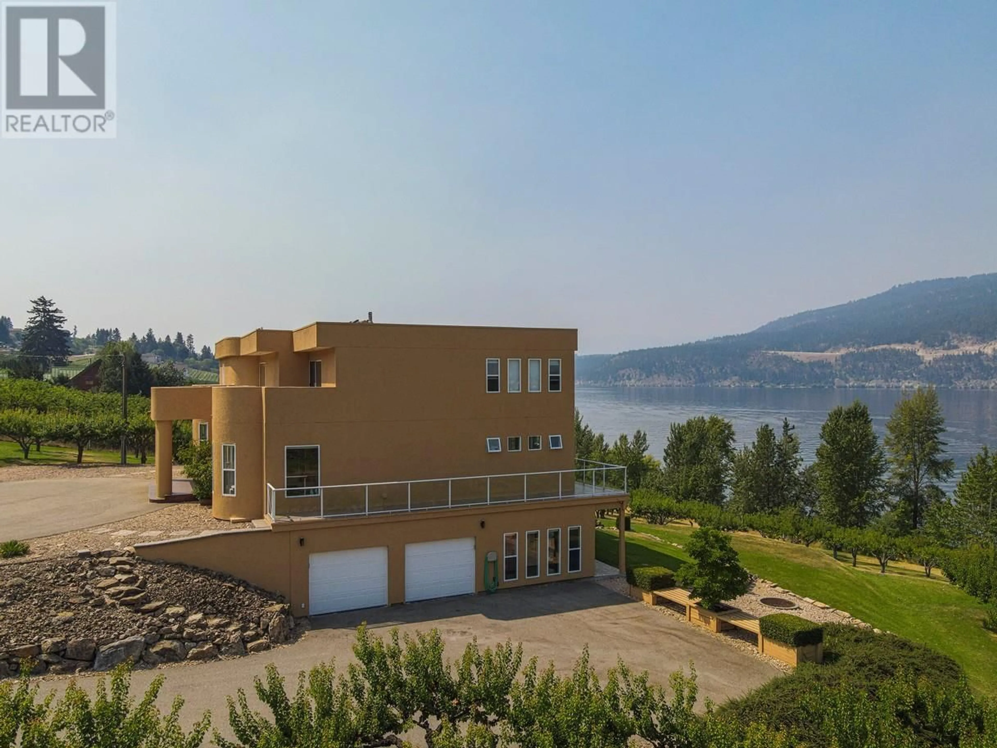 A pic from outside/outdoor area/front of a property/back of a property/a pic from drone, water/lake/river/ocean view for 14752 OYAMA ROAD, Lake Country British Columbia V4V2C6