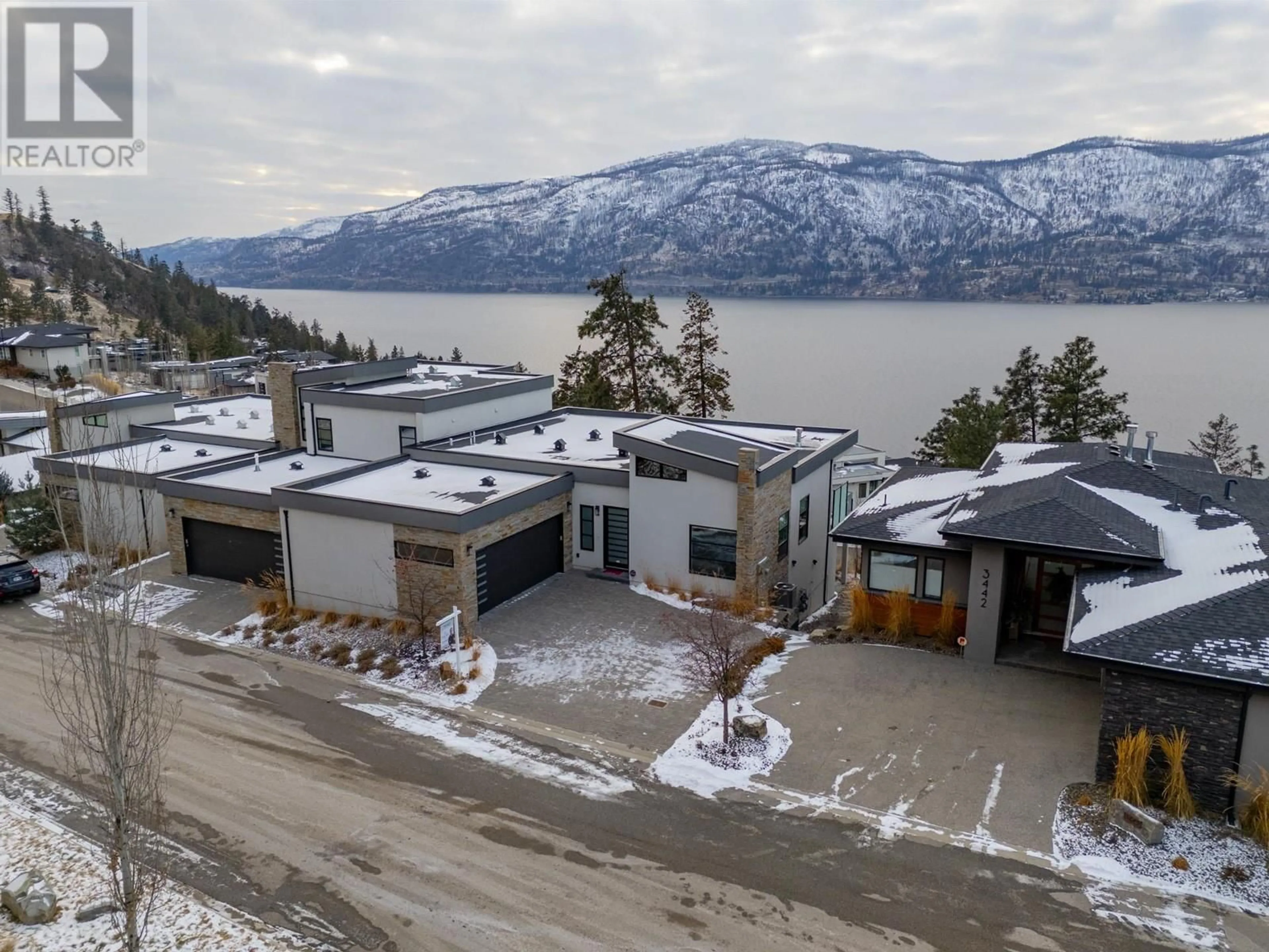 A pic from outside/outdoor area/front of a property/back of a property/a pic from drone, mountain view for 3434 Blue Grass Lane, Kelowna British Columbia V1V3G1