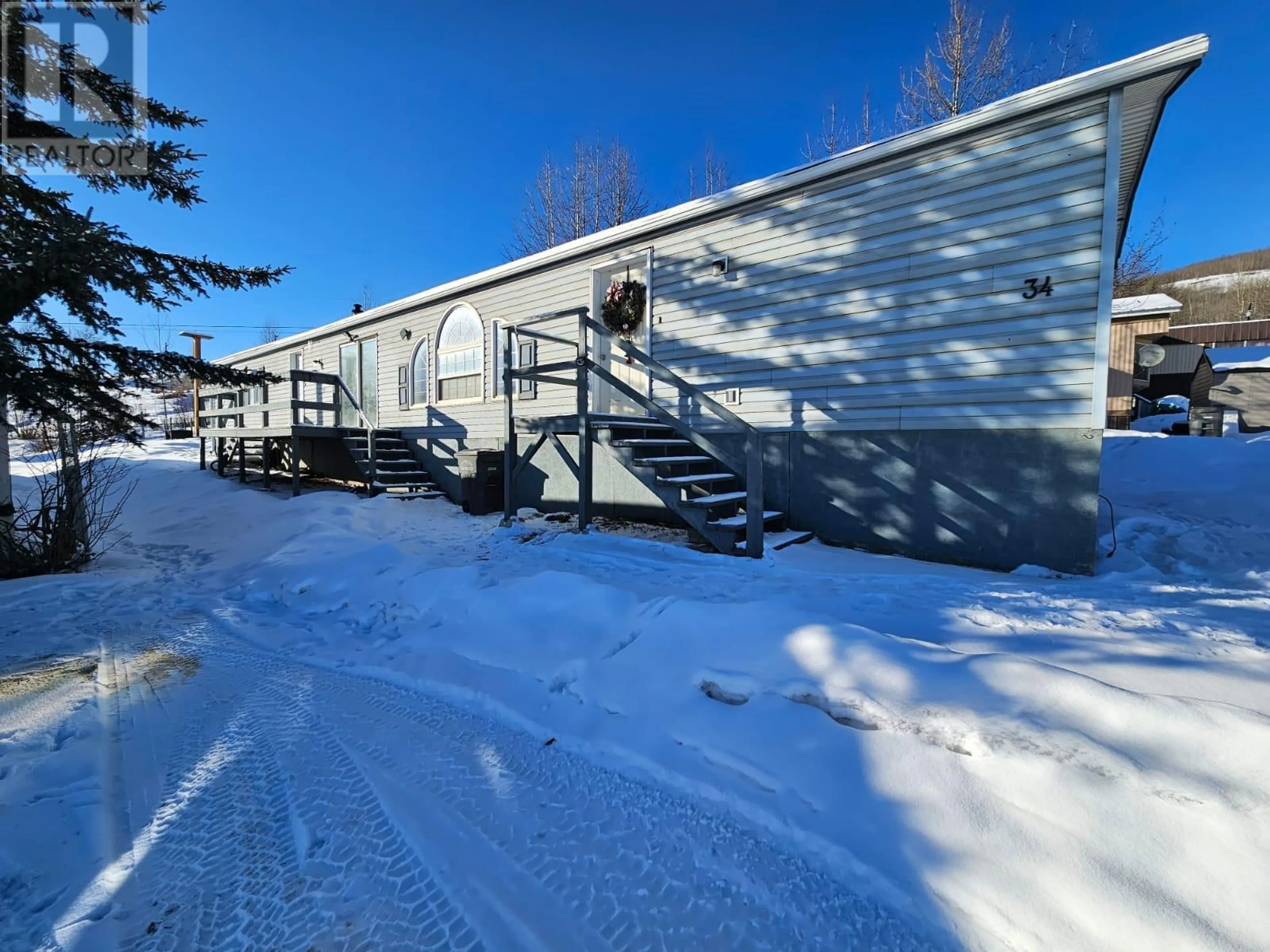 A pic from outside/outdoor area/front of a property/back of a property/a pic from drone, street for 4500 42 Avenue Unit# 34, Chetwynd British Columbia V0C1J0