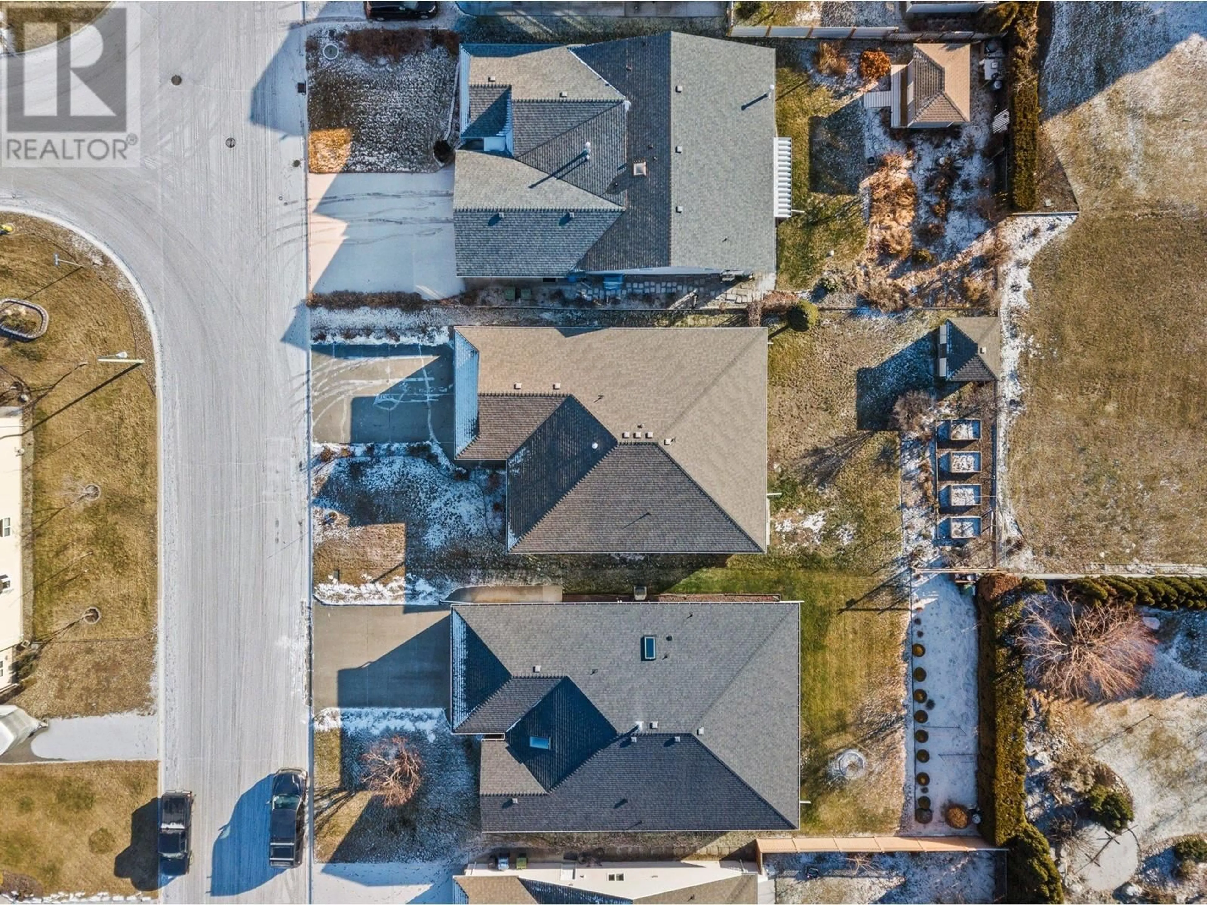 A pic from outside/outdoor area/front of a property/back of a property/a pic from drone, street for 1439 Nelson Place, Kelowna British Columbia V1Y9H5