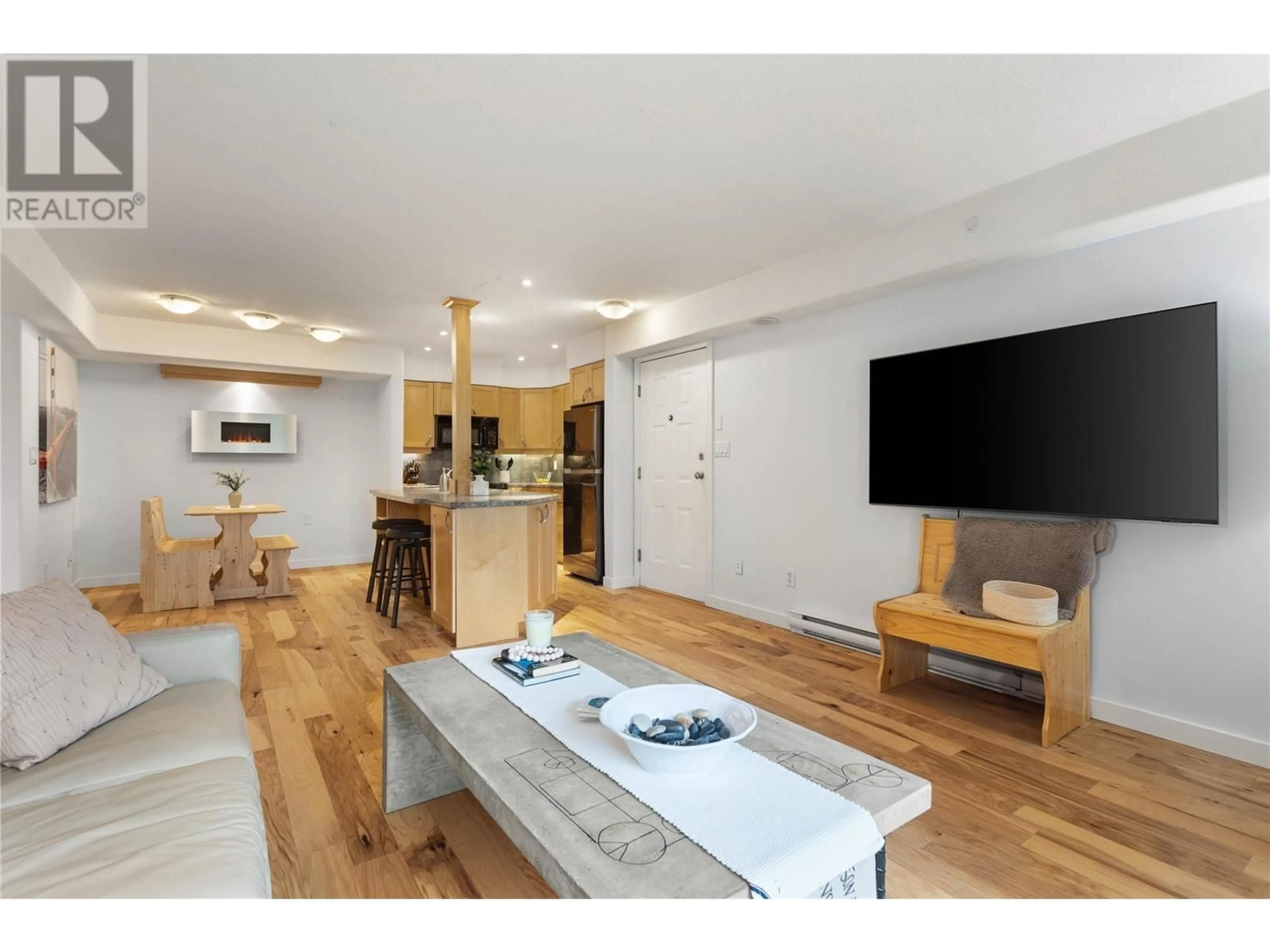 Open concept kitchen, wood/laminate floor for 735 Cook Road Unit# 104D, Kelowna British Columbia V1W3G6