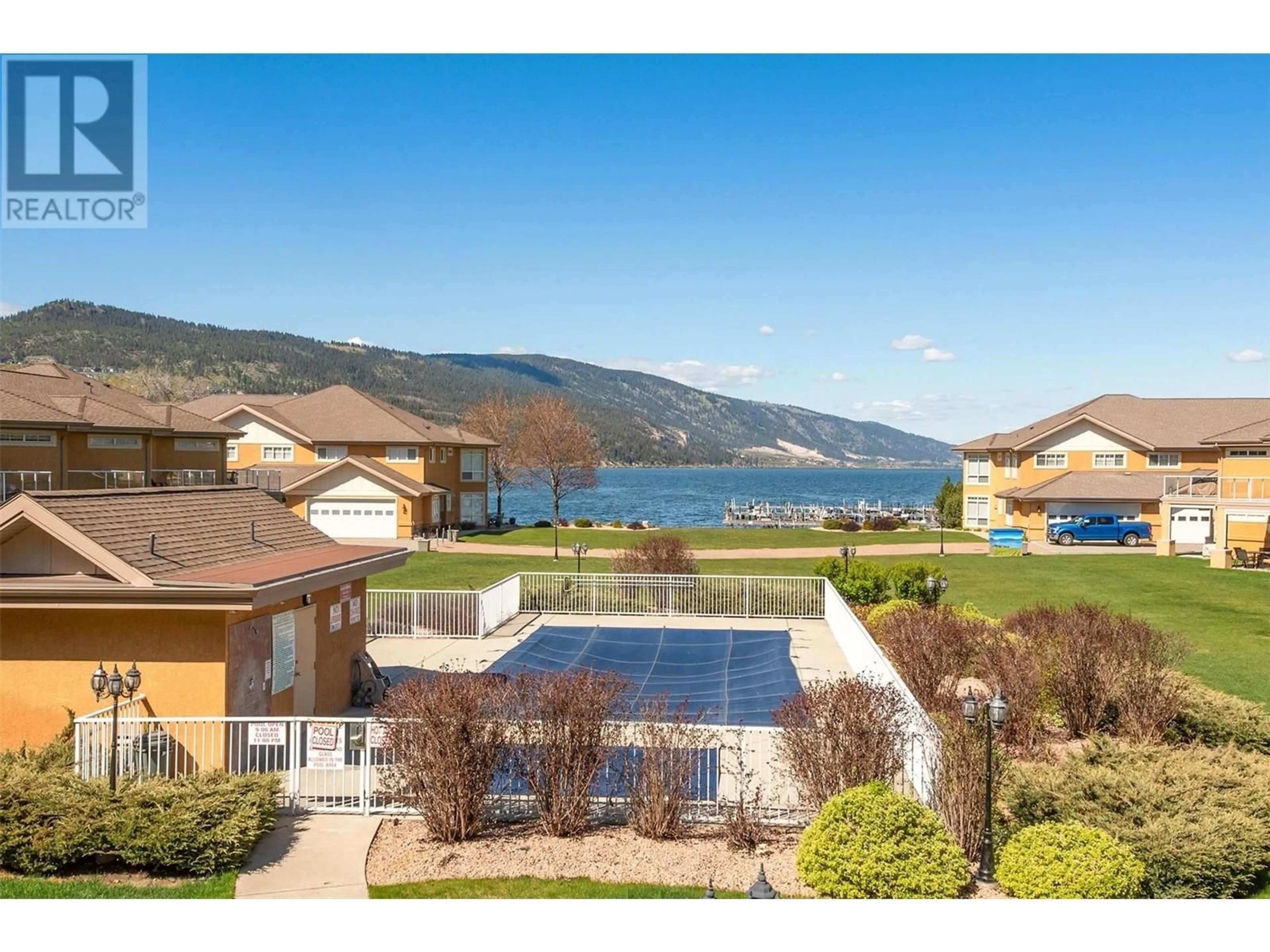A pic from outside/outdoor area/front of a property/back of a property/a pic from drone, water/lake/river/ocean view for 205 - 3570 WOODSDALE ROAD, Lake Country British Columbia V4V1Y9