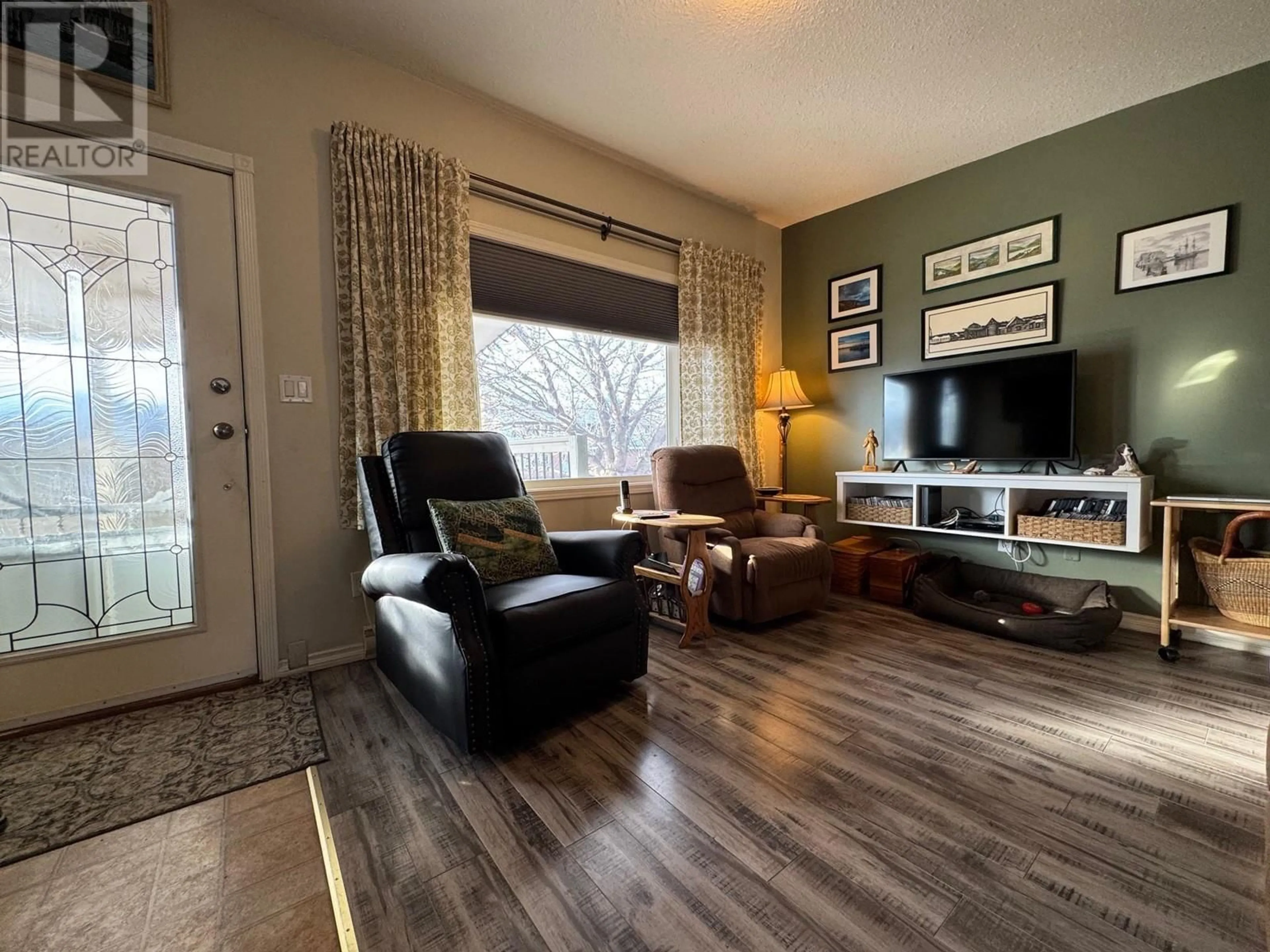 Living room with furniture, wood/laminate floor for 2571 COLDWATER AVENUE, Merritt British Columbia V1K1B8