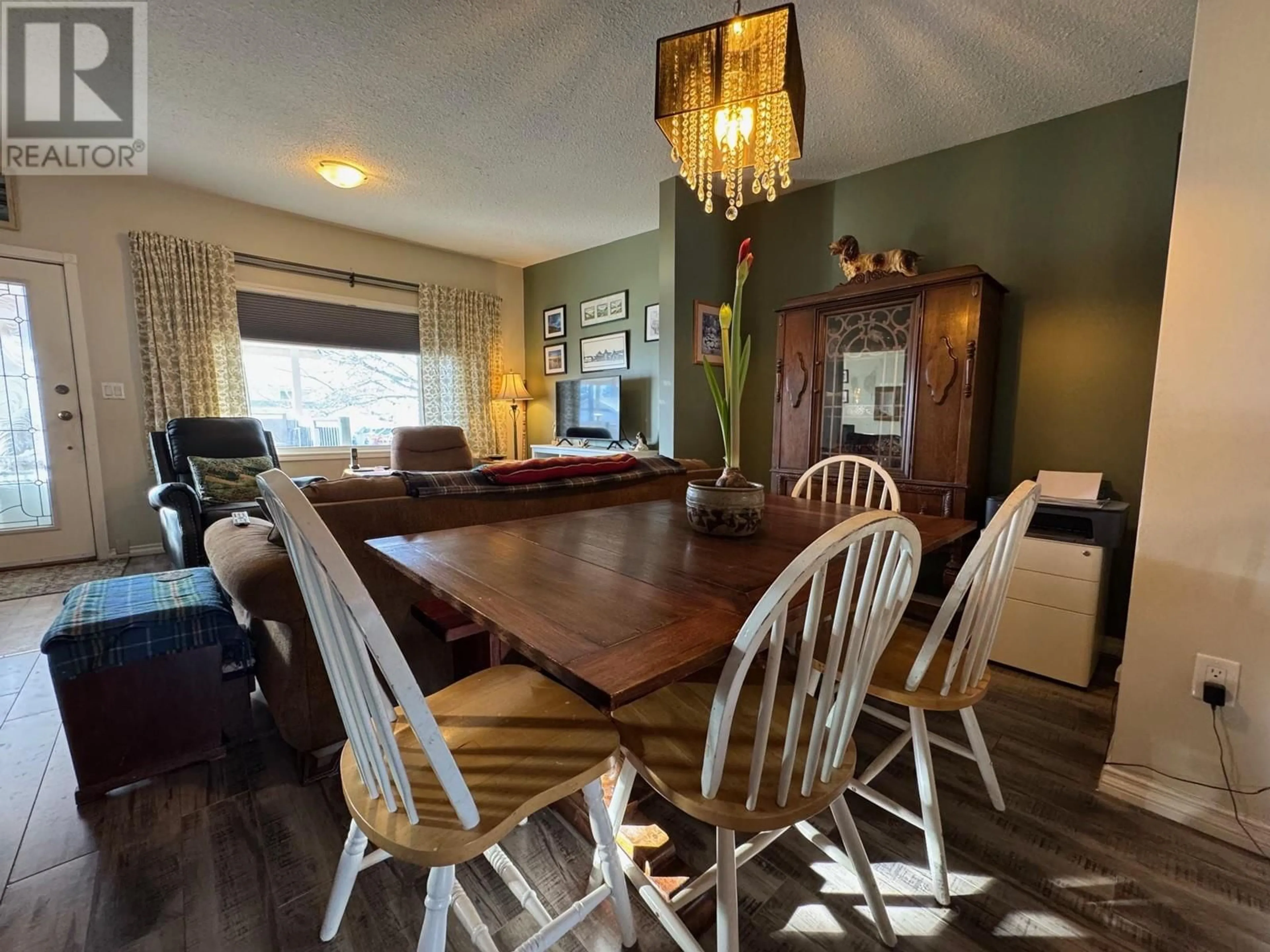 Dining room, wood/laminate floor for 2571 Coldwater Avenue, Merritt British Columbia V1K1B8